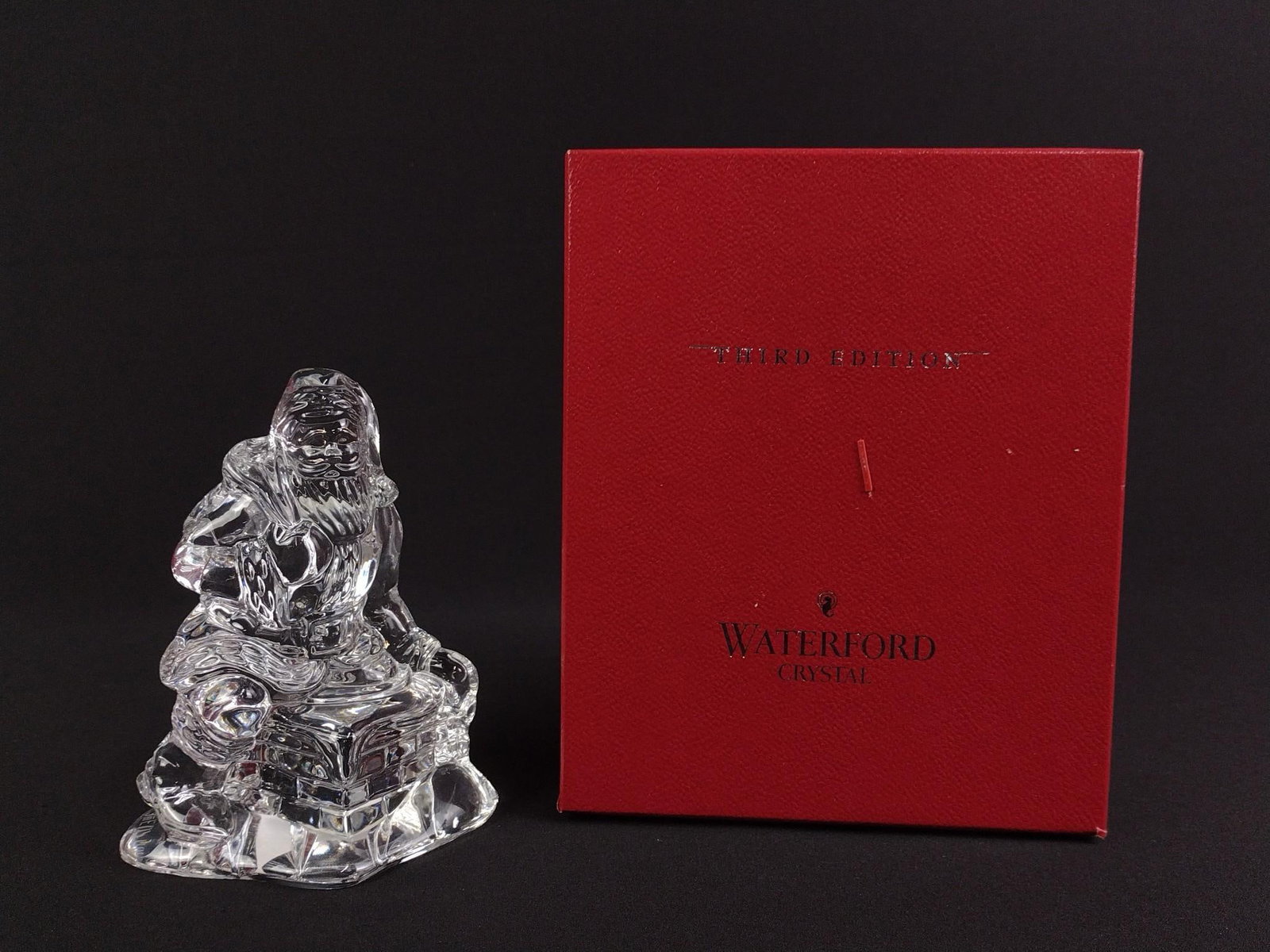 Waterford Crystal "Santa's Arrival": Waterford Crystal "Santa's Arrival" Third Edition figurine, in original box and with original paperwork, measuring 4 - 1/4" x 3 - 1/2" x 5 - 1/2" and acid etched to base "Waterford" as well as "3rd Ed