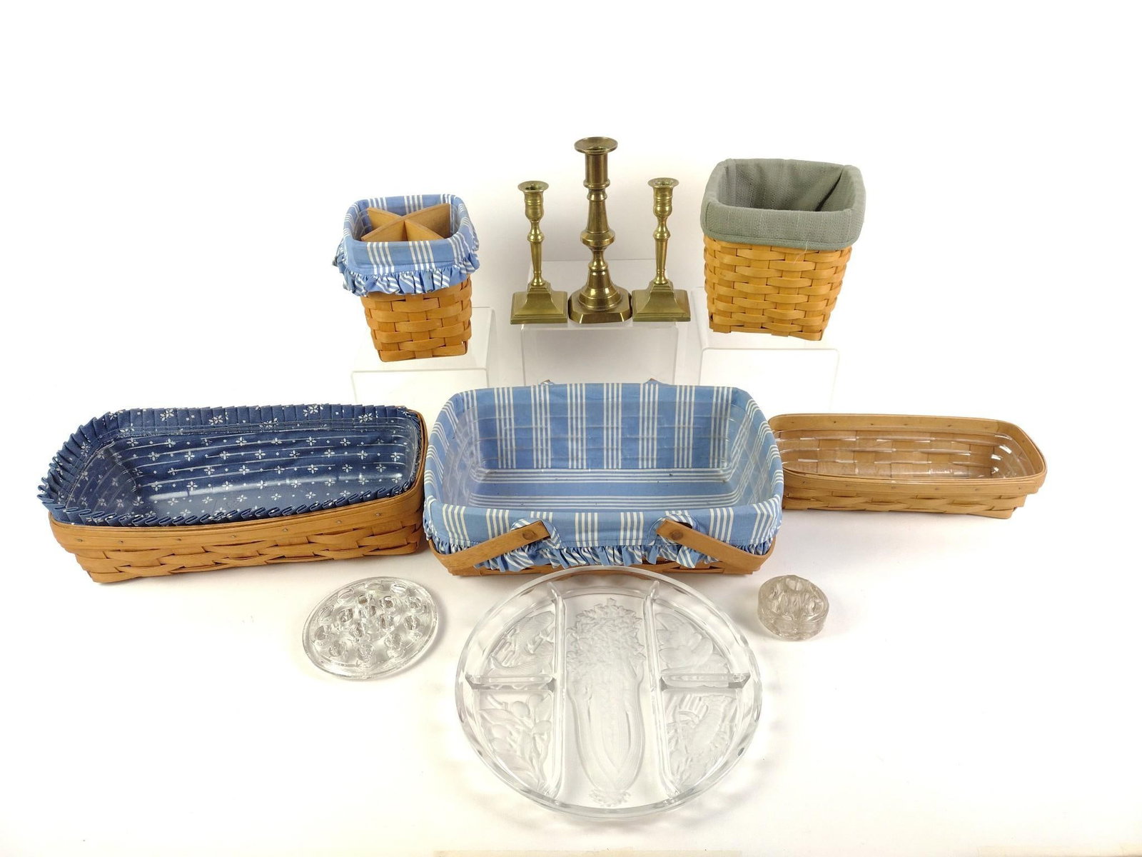 Collectibles Incl. Longaberger: Includes 5 Longaberger baskets, the largest measuring 9 - 1/2" x 14" x 4 - 1/2", 3 brass candlesticks, 2 glass pen stands and a glass tray measuring 10" in diameter.