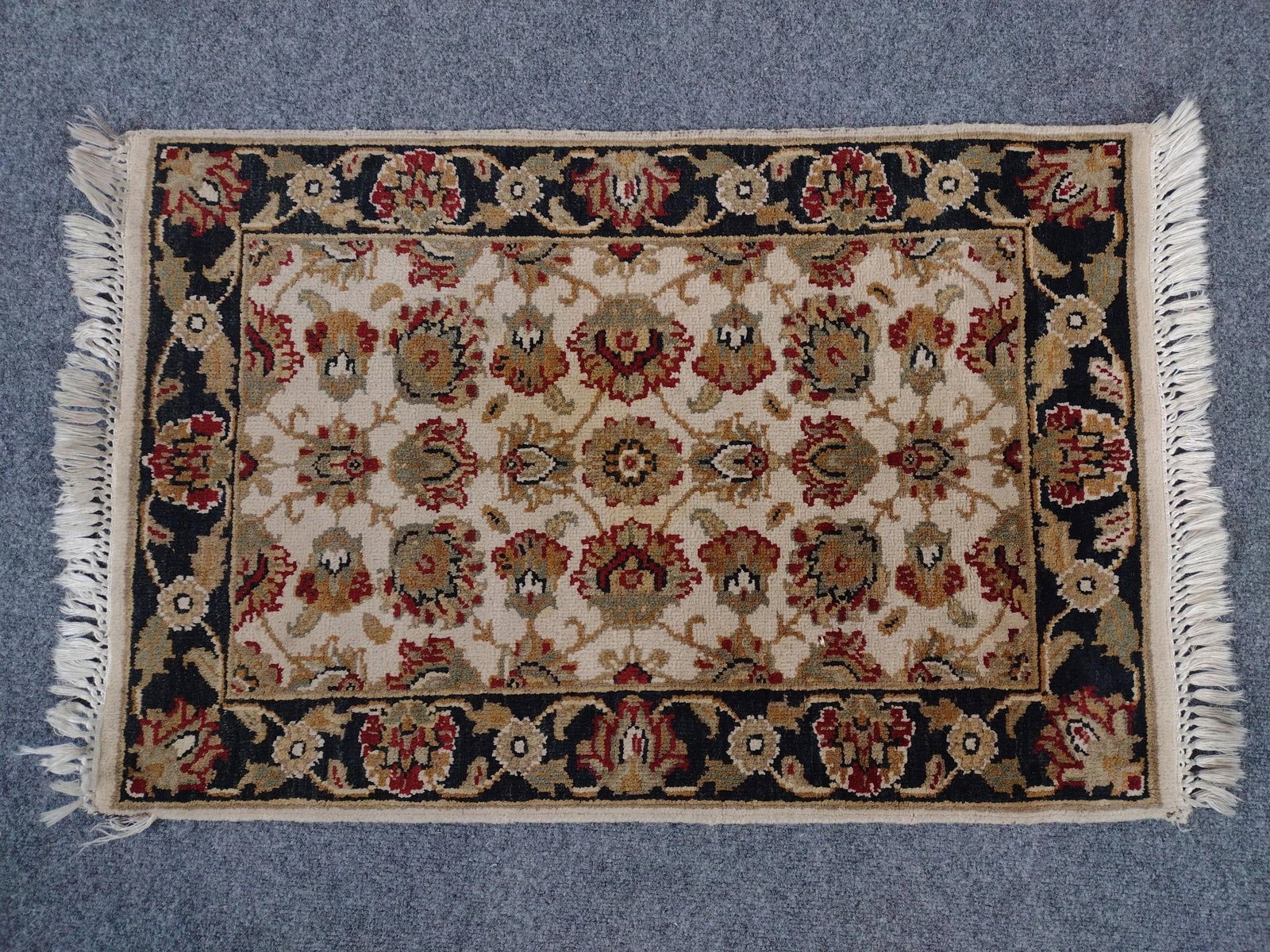 Oriental Area Rug: 3'2" long X 2'1" wide.
