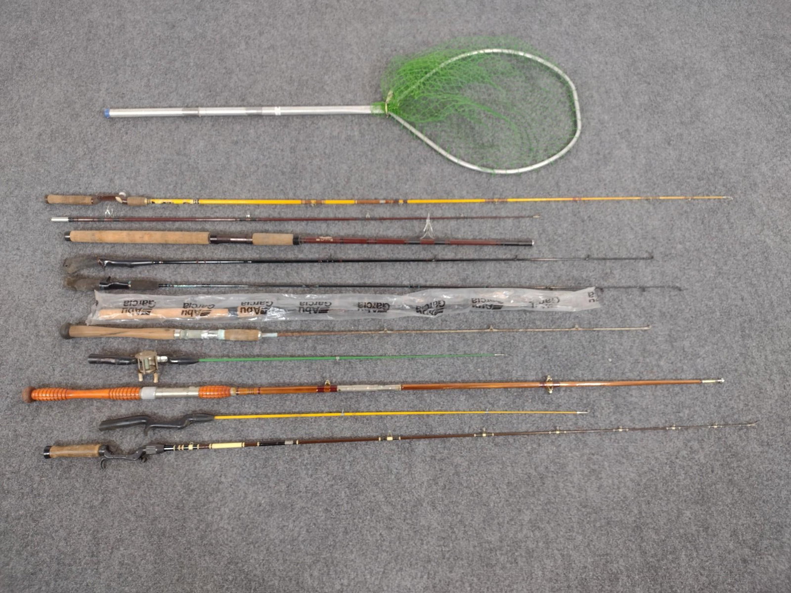 10 Fishing Rods Incl. Net: Rods includes Abu Garcia, Daiwa, and more. 42" to 109" long.