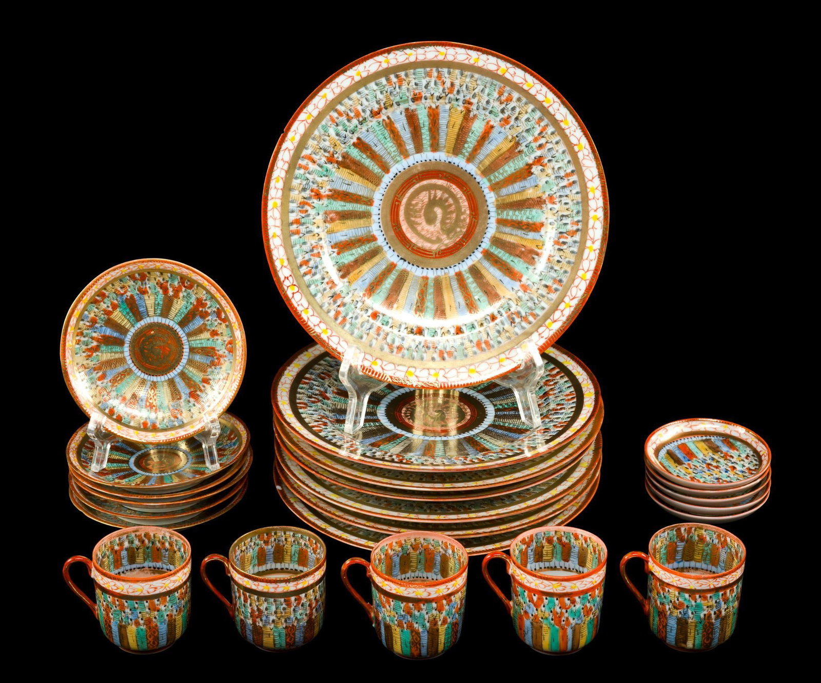 Japanese Kutani Thousand Faces Cups Saucers Plates: A set of ten nephrite jade figural chop stamp pieces. Each is 5 7/8" in height. One has a loss to the point of the hat.