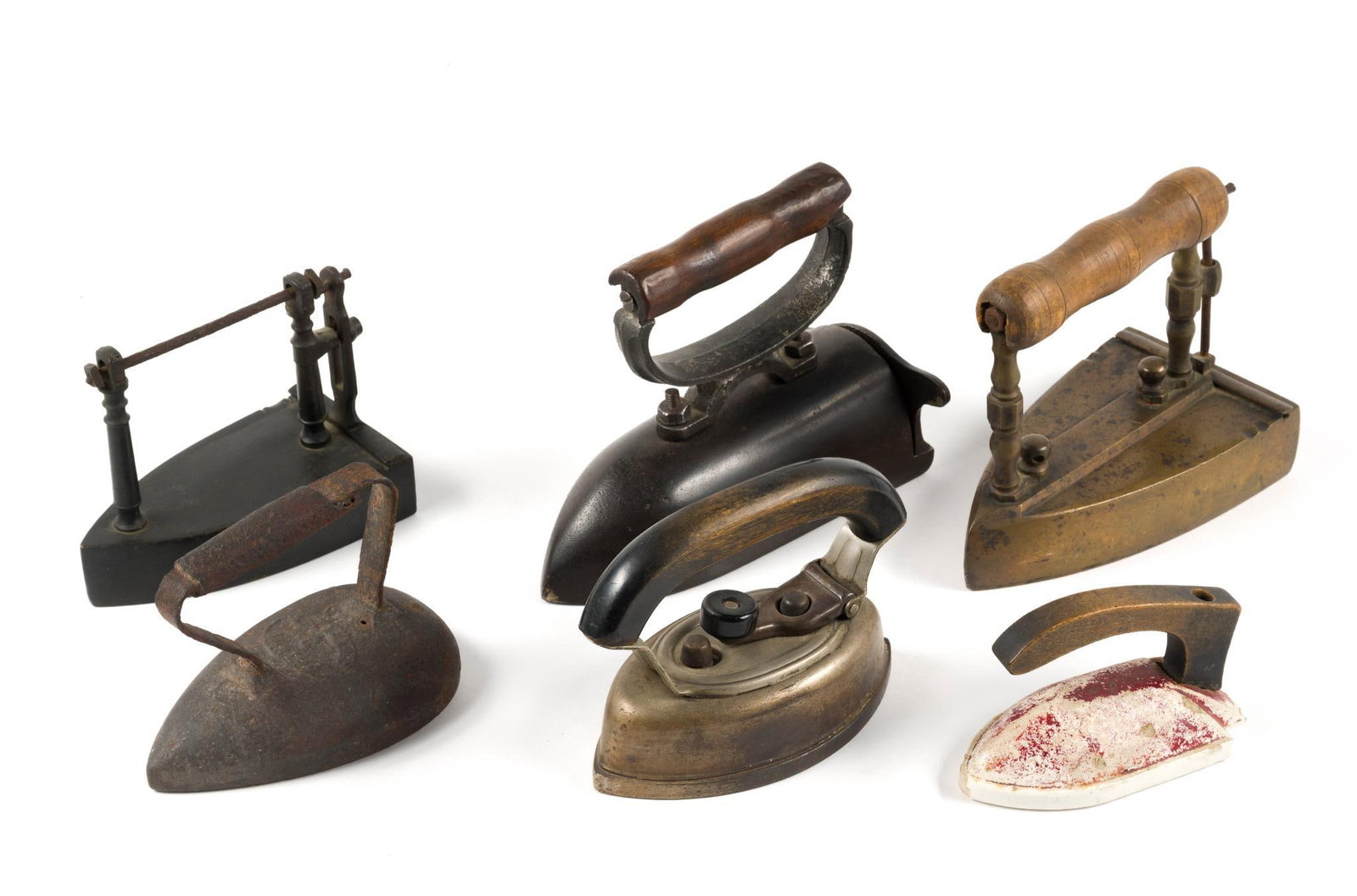 (Reconstruction Era) 6 Vintage Flat Irons: From a private collection. Largest measures 8 - 1/2" x 4 - 1/2" x 7" and the smallest measures 5 - 1/4" x 2 - 1/2" x 3 - 1/2".?