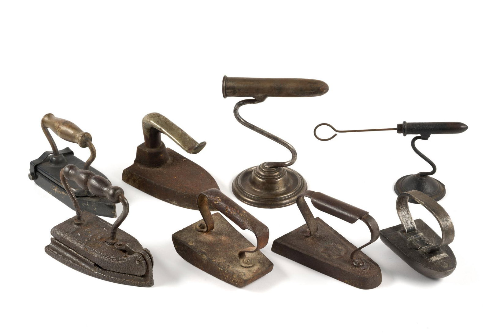 (Reconstruction Era) 6 Flatirons & 2 Goffering Irons: From a private collection. Largest measures 6 - 1/2" x 3 - 1/2" x 5" and the smallest measures 4 - 1/2" x 3 - 1/4" x 4 - 1/4".
