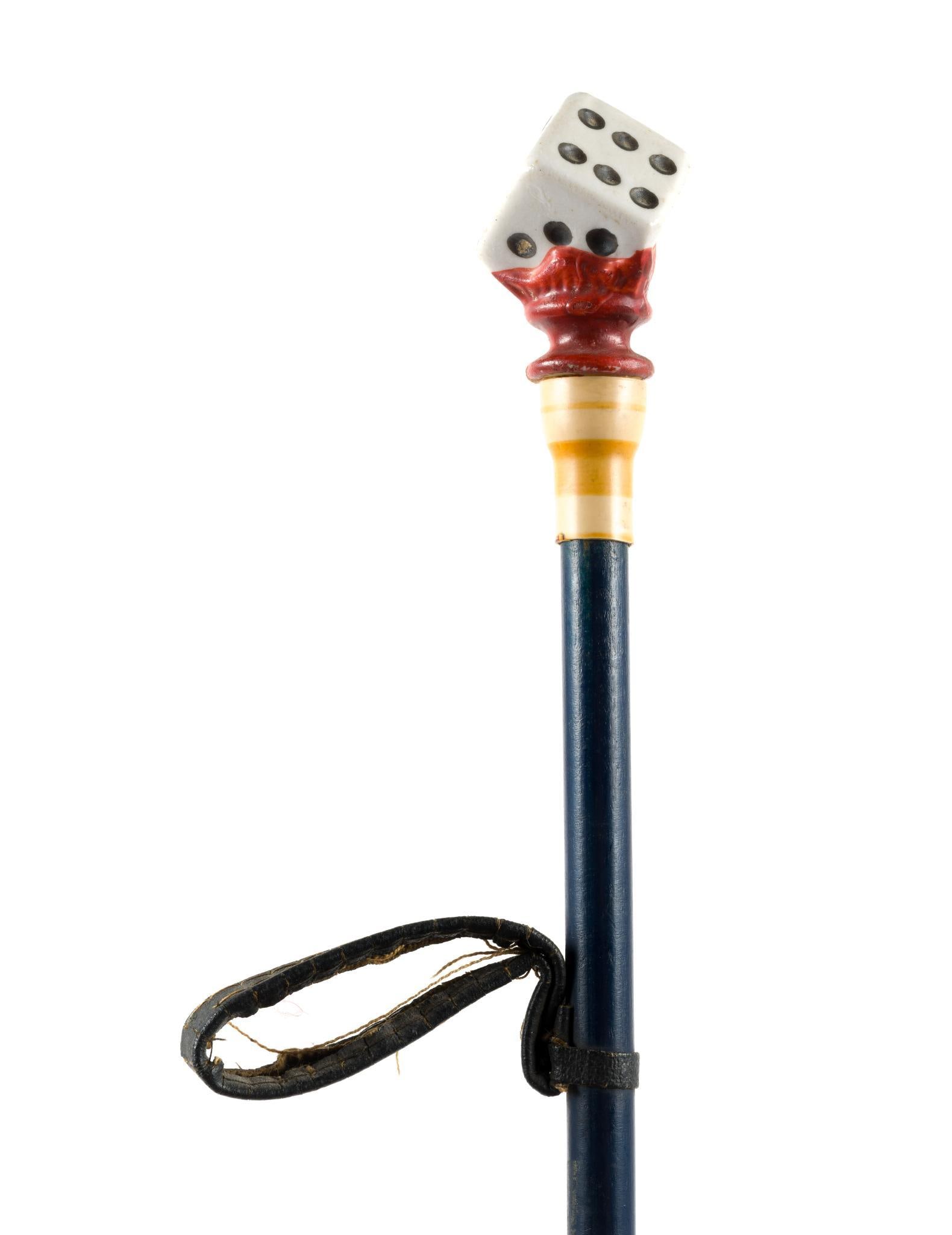 (Gilded Age) Dice Handle Circus Cane: From a private collection. Measures 37 - `1/2" long. Has a leather strap?7" from the top of the cane.?