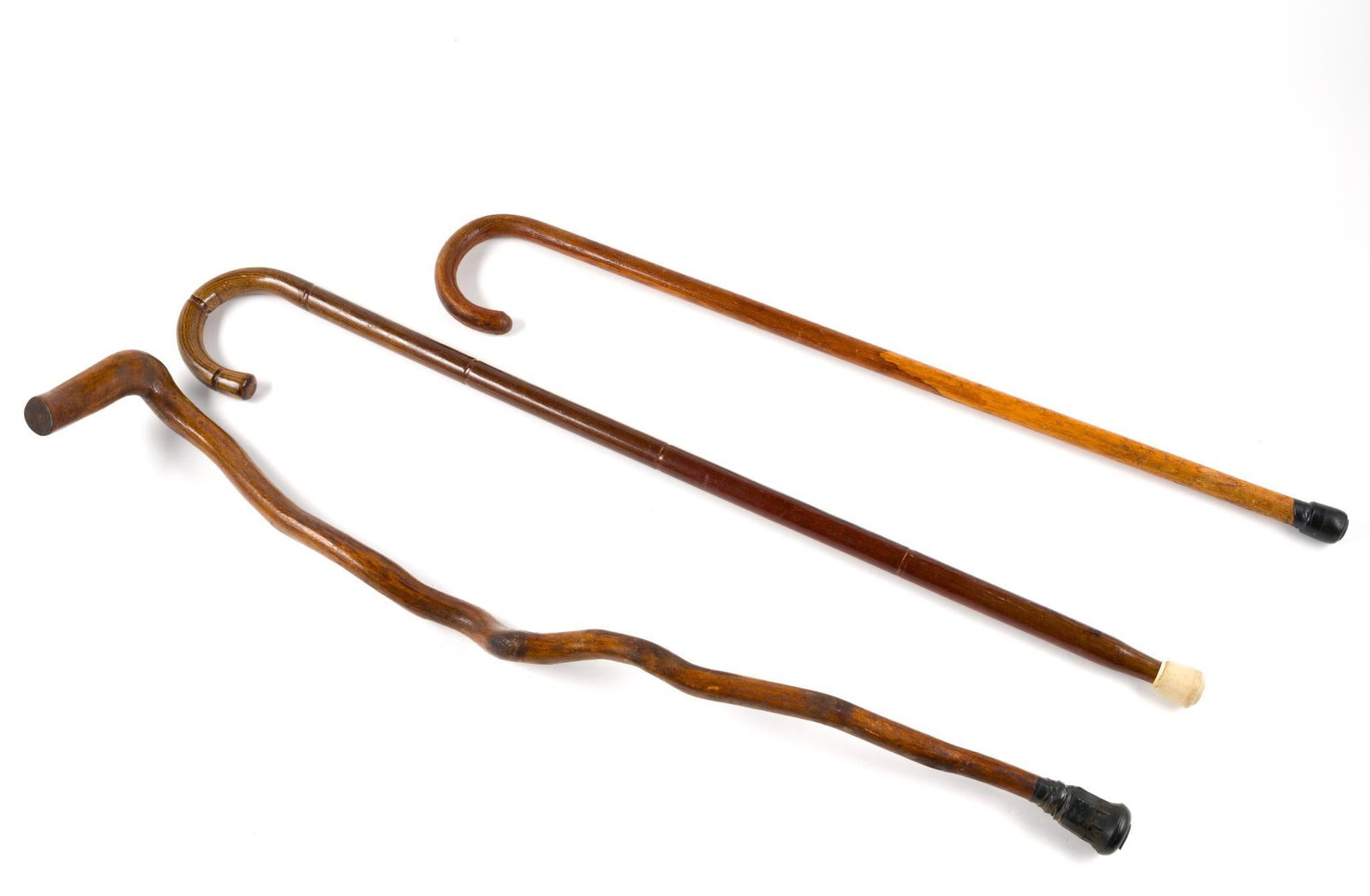 (Gilded Age) 3 Rustic Wooden Canes: From a private collection. Canes measure between 32 - 1/4" and 36 - 1/2" in length.