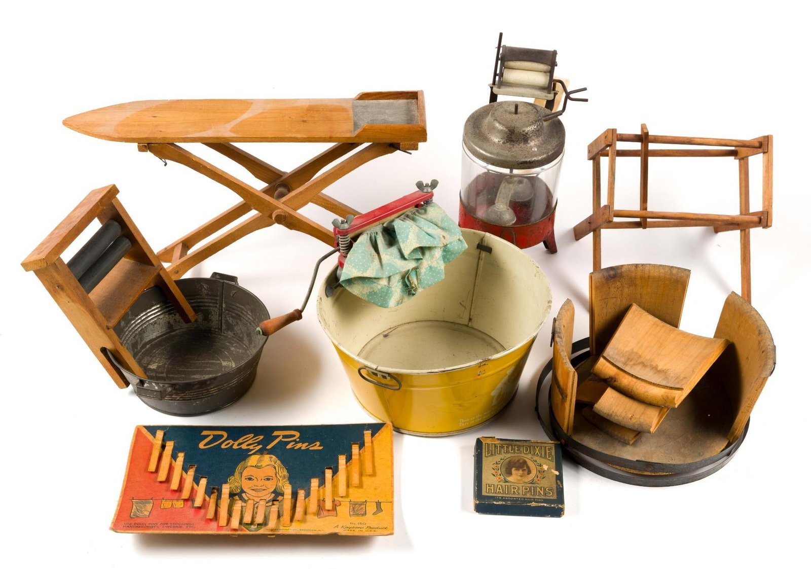 (Progressive Era) Antique Children's Laundry Toys: From a private collection. Includes?a wooden ironing board, toy wash tub and a wringer, as well as?Dolly Pins and Little Dixie Hair Pins in their original boxes. Also includes?a vintage C.G. Wood Co. 