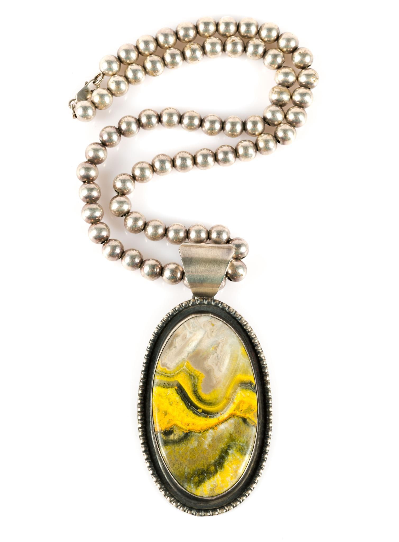 (Modern Era) Chimney Butte Sterling Silver Navajo Necklace: Stamped on the back of the pendant. Pendant measures 1-7/8" wide x 3-3/4" long, chain 20-1/4" long. 2.95 ozt total.?