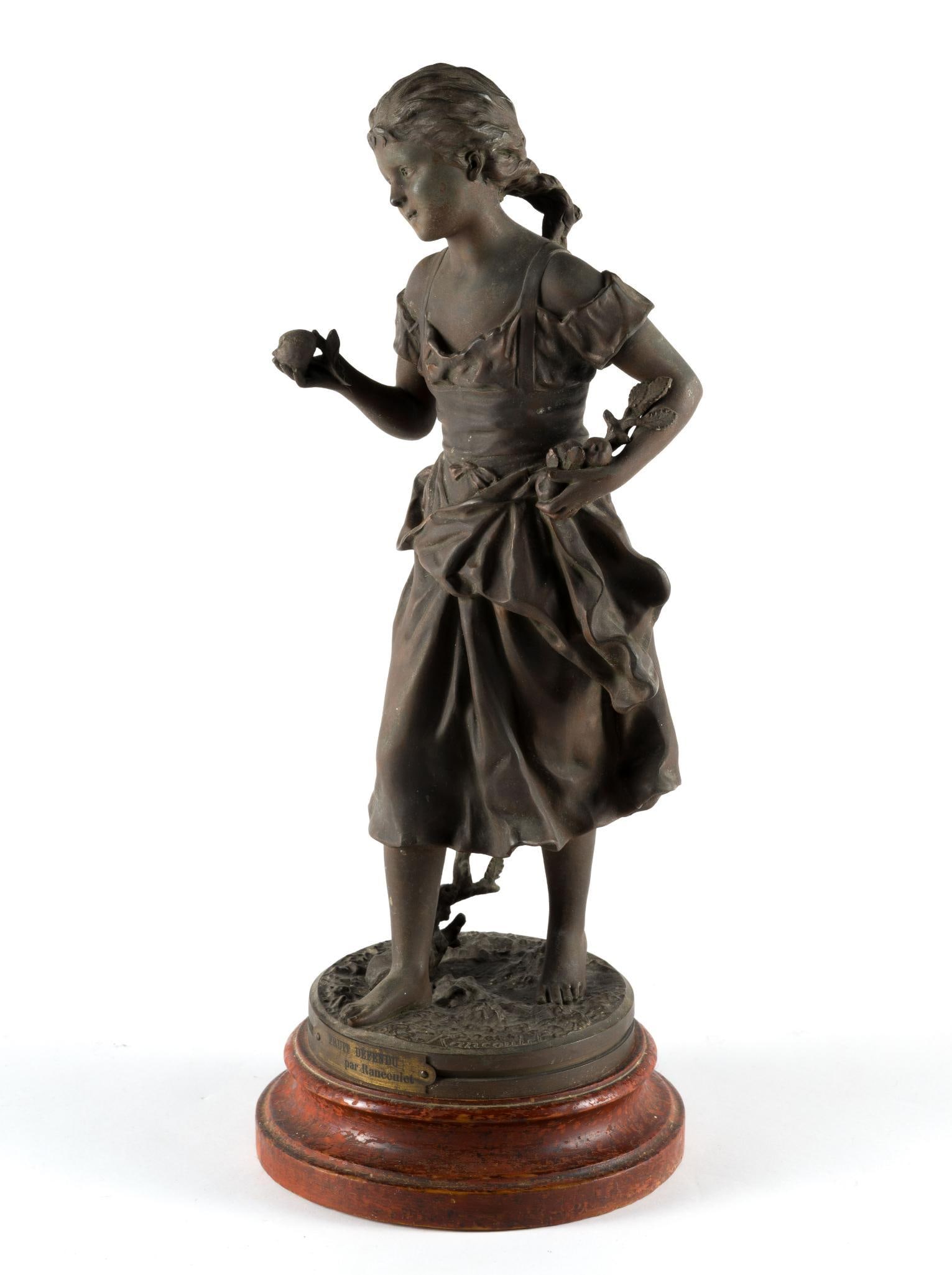 Spelter Bronze Sculpture After Ernest Rancoulet: A French spelter metal piece with bronze patina 8" diameter X 20-1/4" high. It is titled Fruit Defendu (Forbidden Fruit). The sculpture height not including the wood base is 18". It is in excellent co