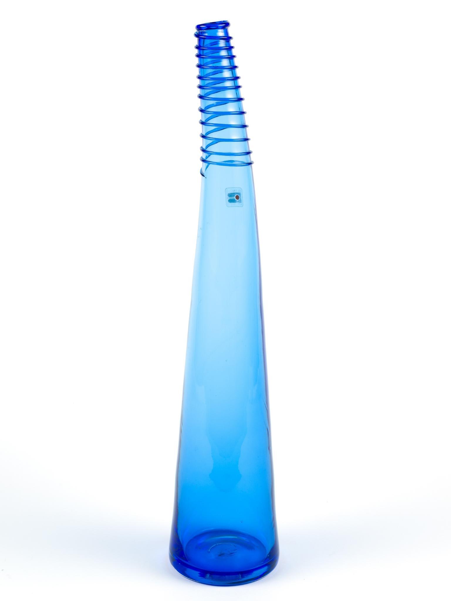 Blenko Blue Glass Vase: Blenko Glass Company has been a family owned and operated company since 1893. We have been located in Milton, WV since 1921. Exquisite color, skilled craftsmen, and imaginative designs have made Blenk