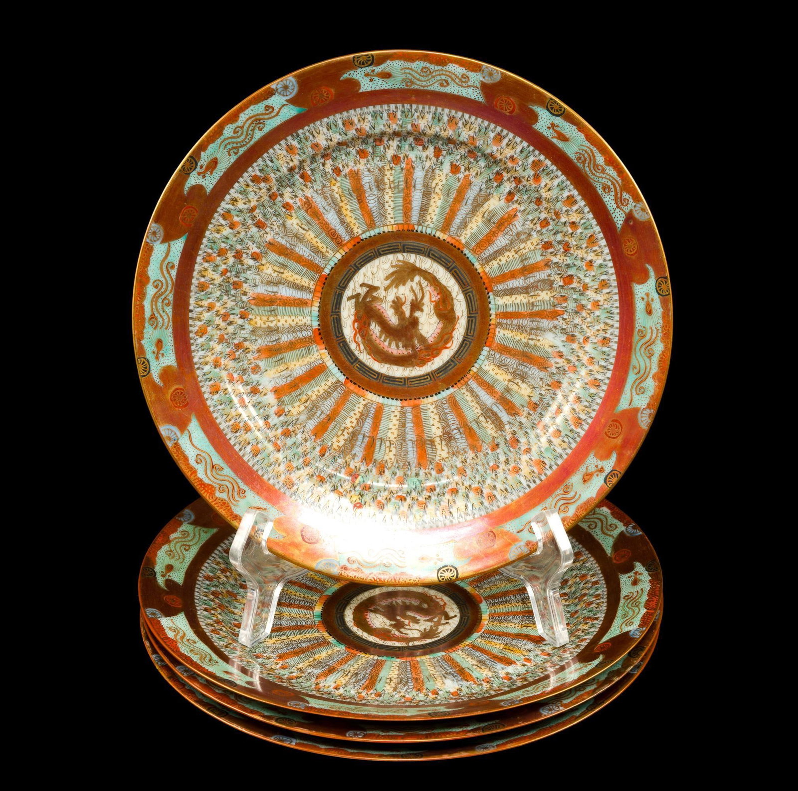 Four Antique Japanese Kutani Thousand Faces Plates: The plates are a matched set 8 1/2" diameter likely from the early Meiji period when the "thousand faces" designs originated. Two of the four plates have Victorian era stapling repairs to the undersid