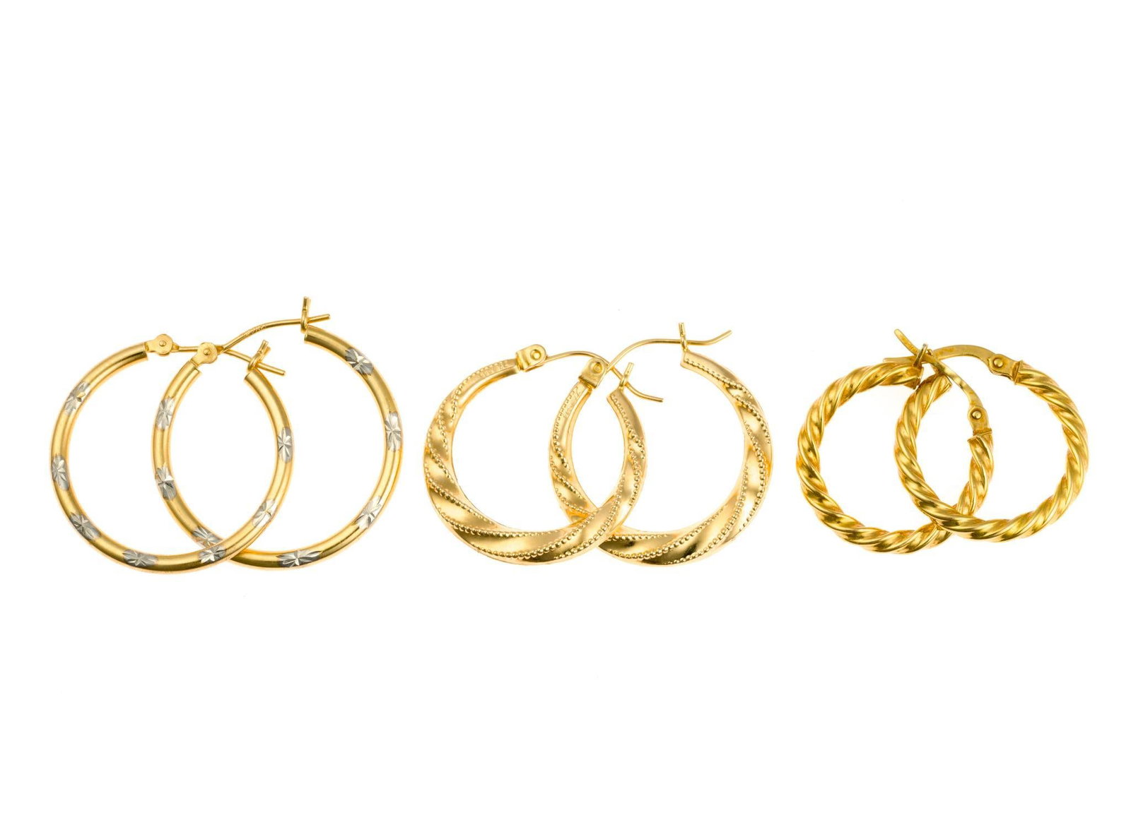 Three Pairs 14K Gold Hoop Earrings: Yellow gold hoop earrings for pierced ears ranging 3/4" to 1" diameter. Weight is 4.3 grams.