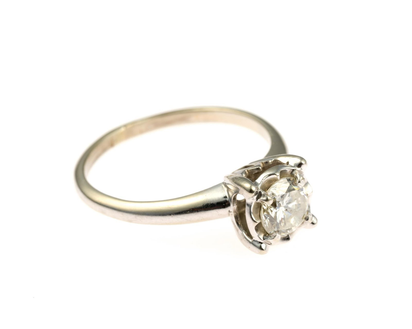 14K Gold and .70 Ct Diamond Ring: A size 7.5 white gold ring with approximately 0.7 carat diamond solitaire, approximately I-2 Clarity (due to large central inclusion on table), K-L Color. The ring weighs 2.8 grams. Accompanied by