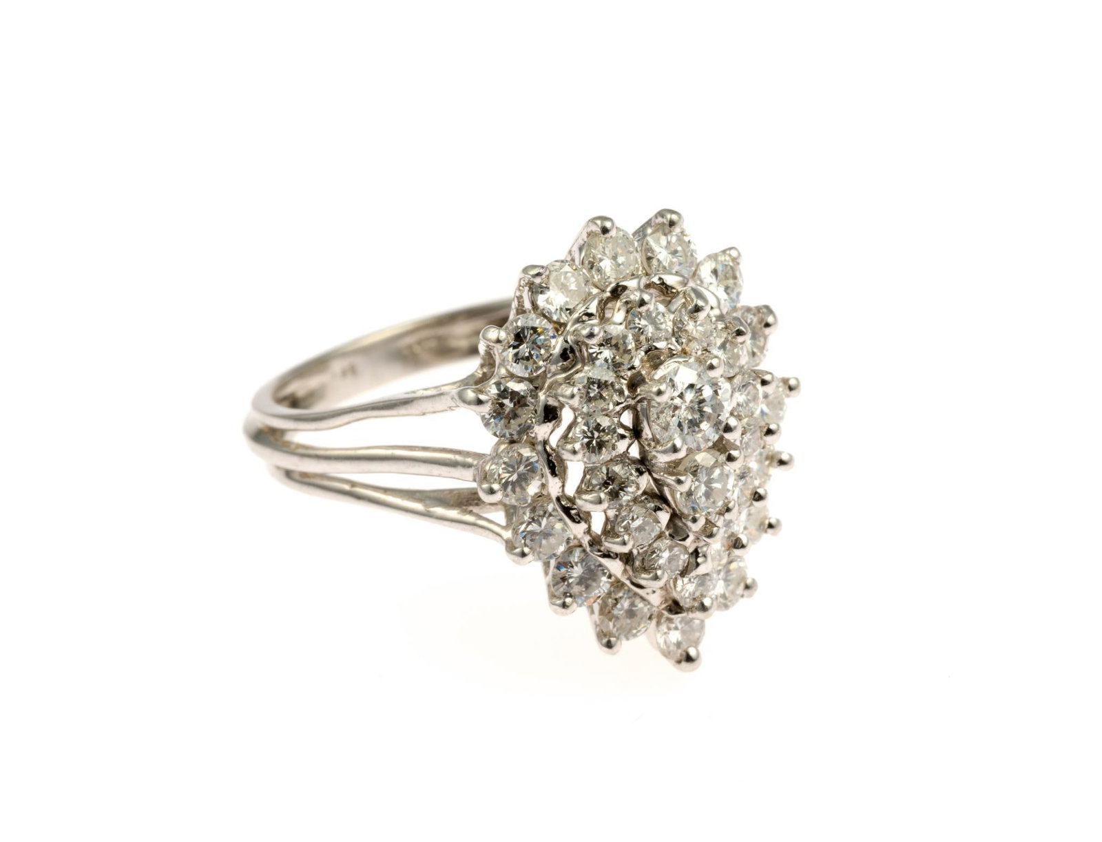 14K Gold and 2 CTW Diamond Ring: A size 7.5 white gold cocktail ring with 31 diamonds totaling 2 carats and placed in a teardrop arrangement. The ring weighs 5.5 grams. 