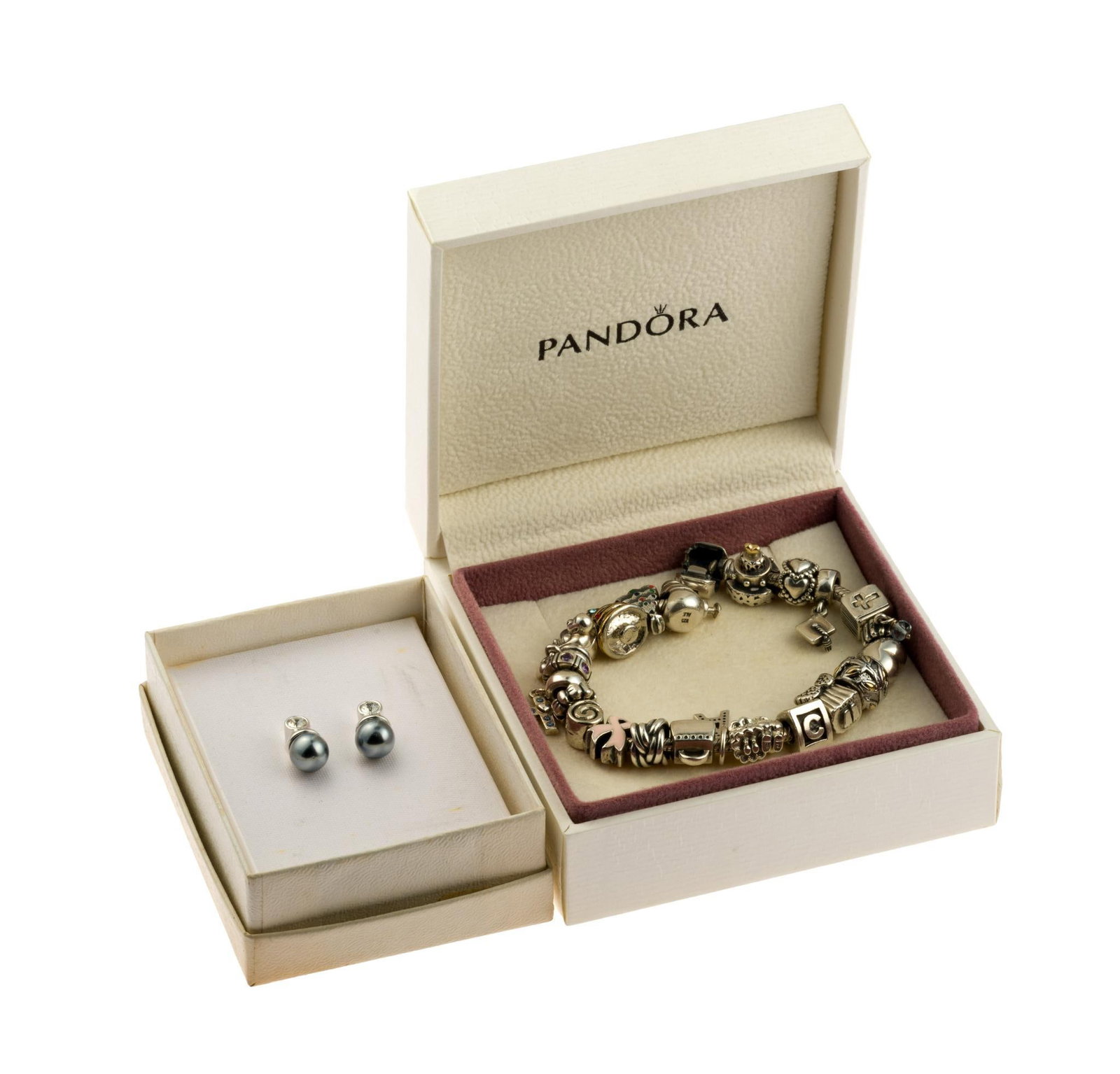 Sterling Silver Pandora Charm Bracelet: The charm bracelet is 7 1/2", loaded with charms, in the original Pandora box. Also included are vintage Nolan Miller Glamour Collection pearl earrings. The charm bracelet weighs 2.4 troy ounces.