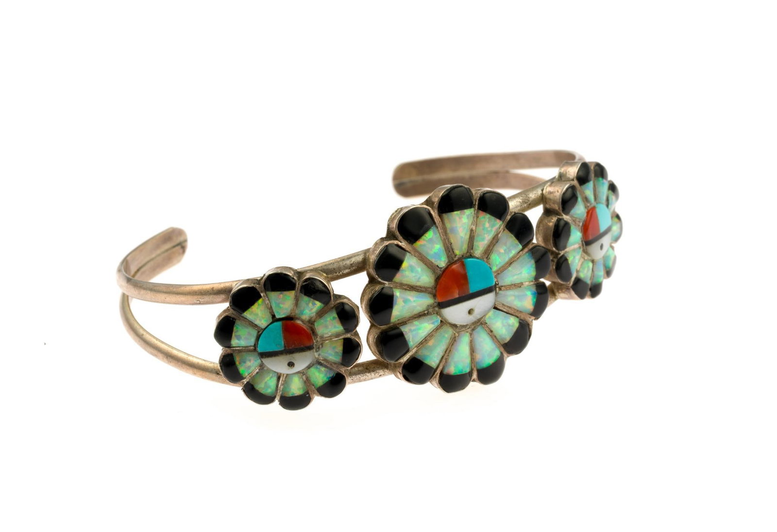 Vintage Zuni Sterling Silver Sun Face Cuff Bracelet: The bracelet is 2 1/4" inner width, 1 1/8" opening, 1" diameter largest sun-face. Gemstone includes turquoise, shell, opal, onyx. Unsigned.