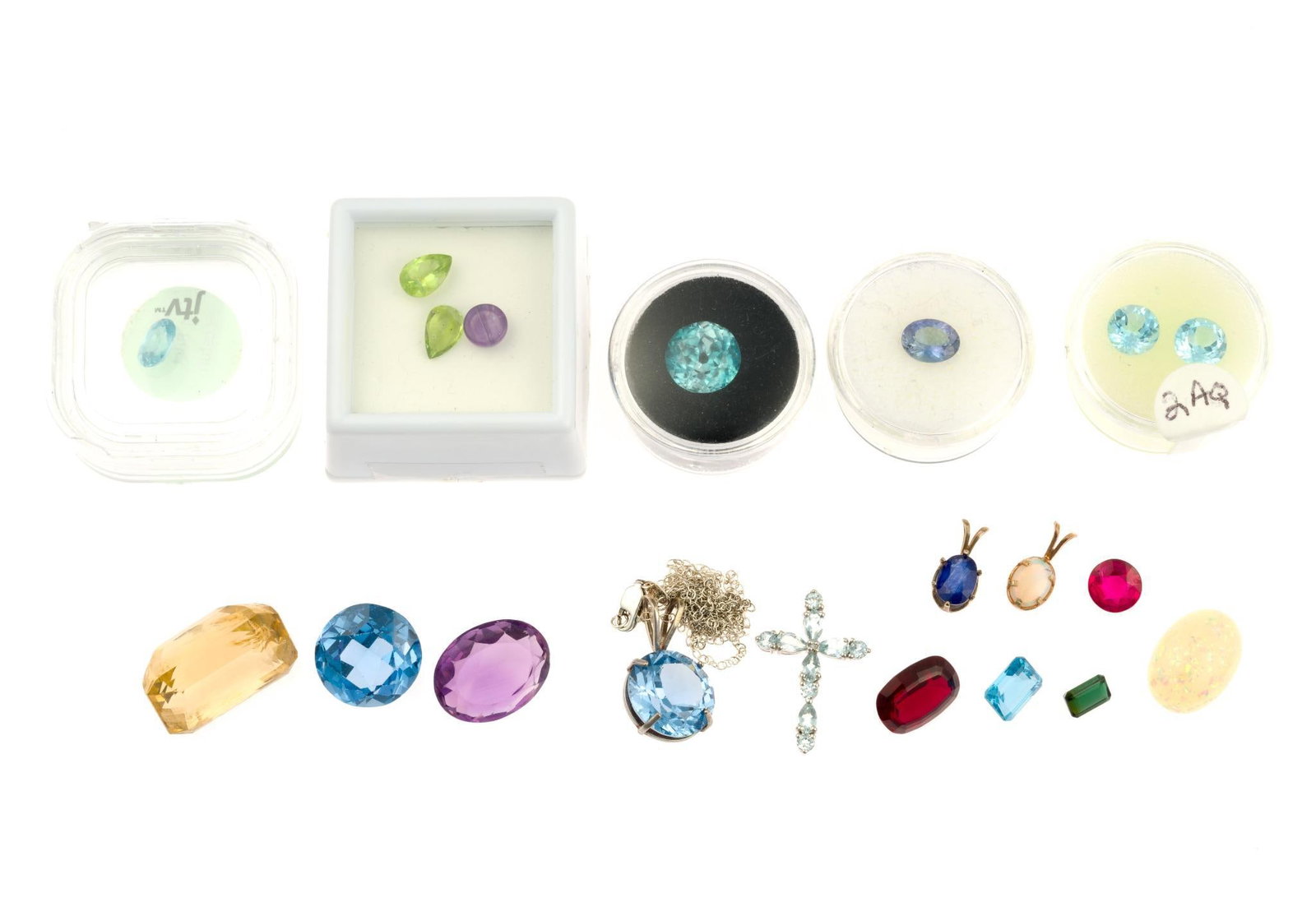 Loose Gemstones Including Tanzanite and Tourmaline: 3 carat topaz, 1.7 carat tanzanite, 1.5 carat tourmaline, 16 carat amethyst, 9 carat zircon, 2 carat aquamarine, 2.5 carat aquamarine, others including ruby. Some stones such as the round ruby are