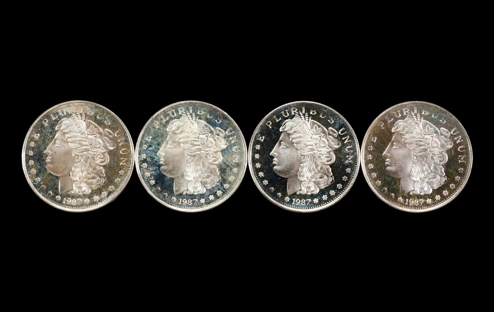 Four Silver Bullion Cons: Each is one troy ounce pure silver.
