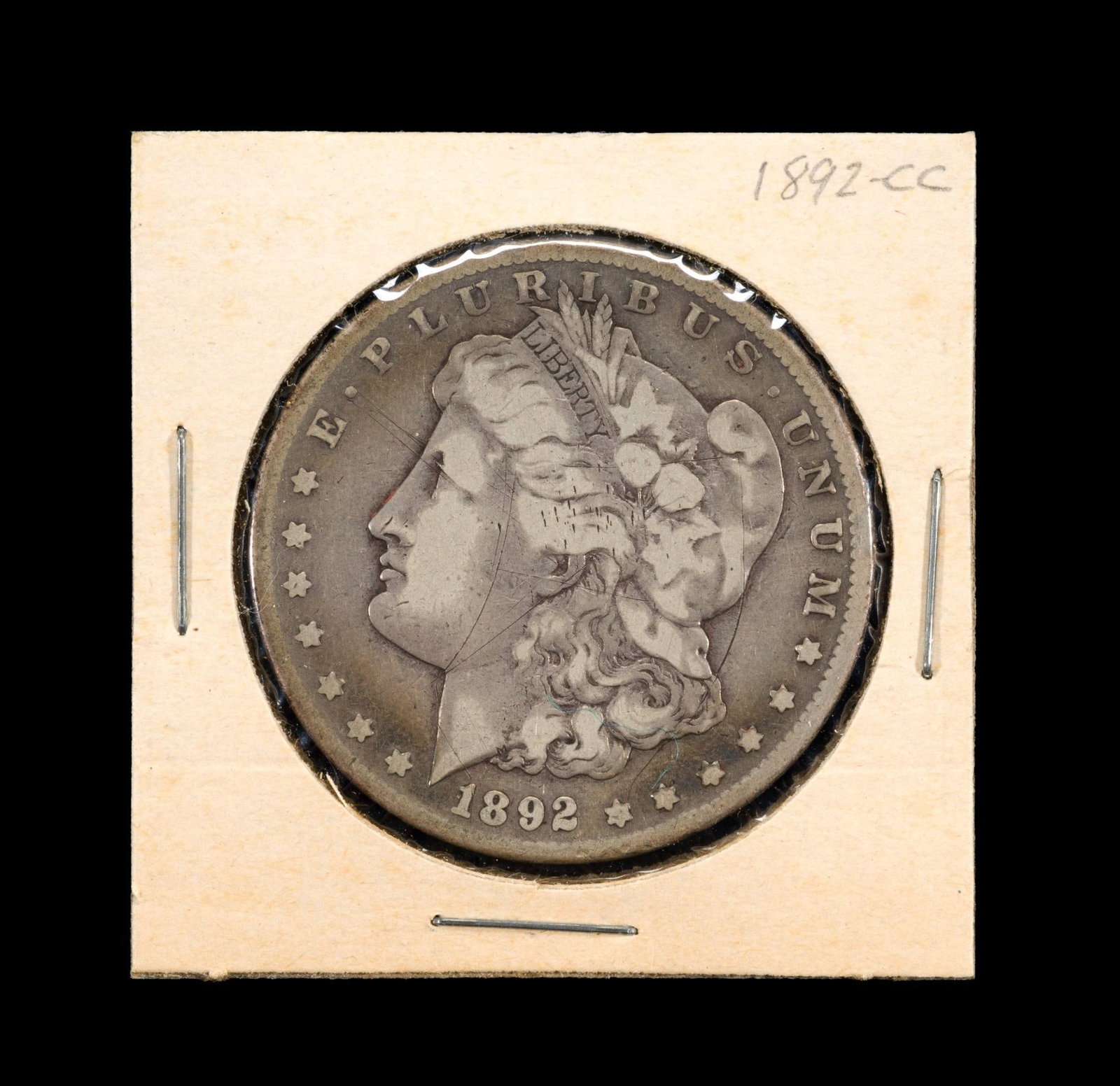 1892-CC Morgan Dollar: 1892 Carson City silver dollar in VF condition with good surfaces.