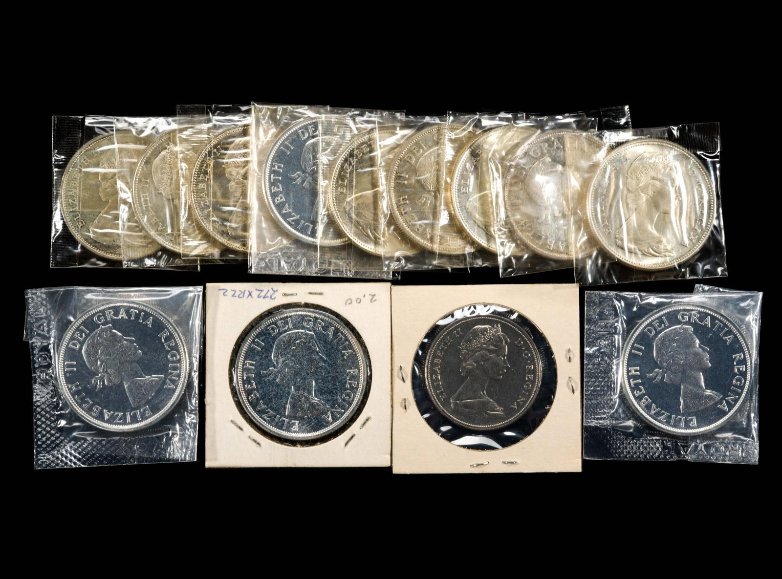 Twelve Uncirculated Canada Silver Dollars: Additionally a Manitoba 1970 non-silver dollar. Some of the uncirculated silver dollars are proof-like.