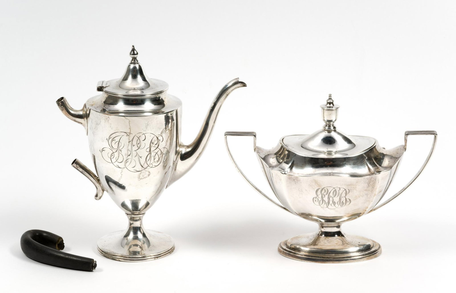 Sterling Silver Tea Pot & Sterling Silver Sugar Dish: One marked Gorham and other marked Wilcox & Wagoner. Tea pot handle is not attached. 6-3/4" to 7-3/4" wide x 6-1/4" to 8-1/4" high. 17.45 ozt total.?