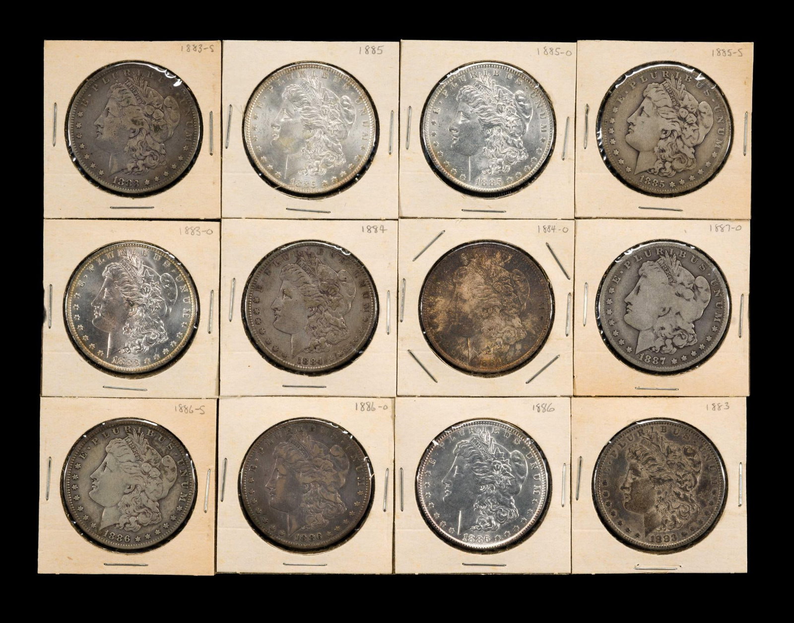 Morgan Silver Dollar Series Twelve Coins: Includes Four high uncirculated coins. 1886 as example is above MS65. Please note some edge tarnish.
