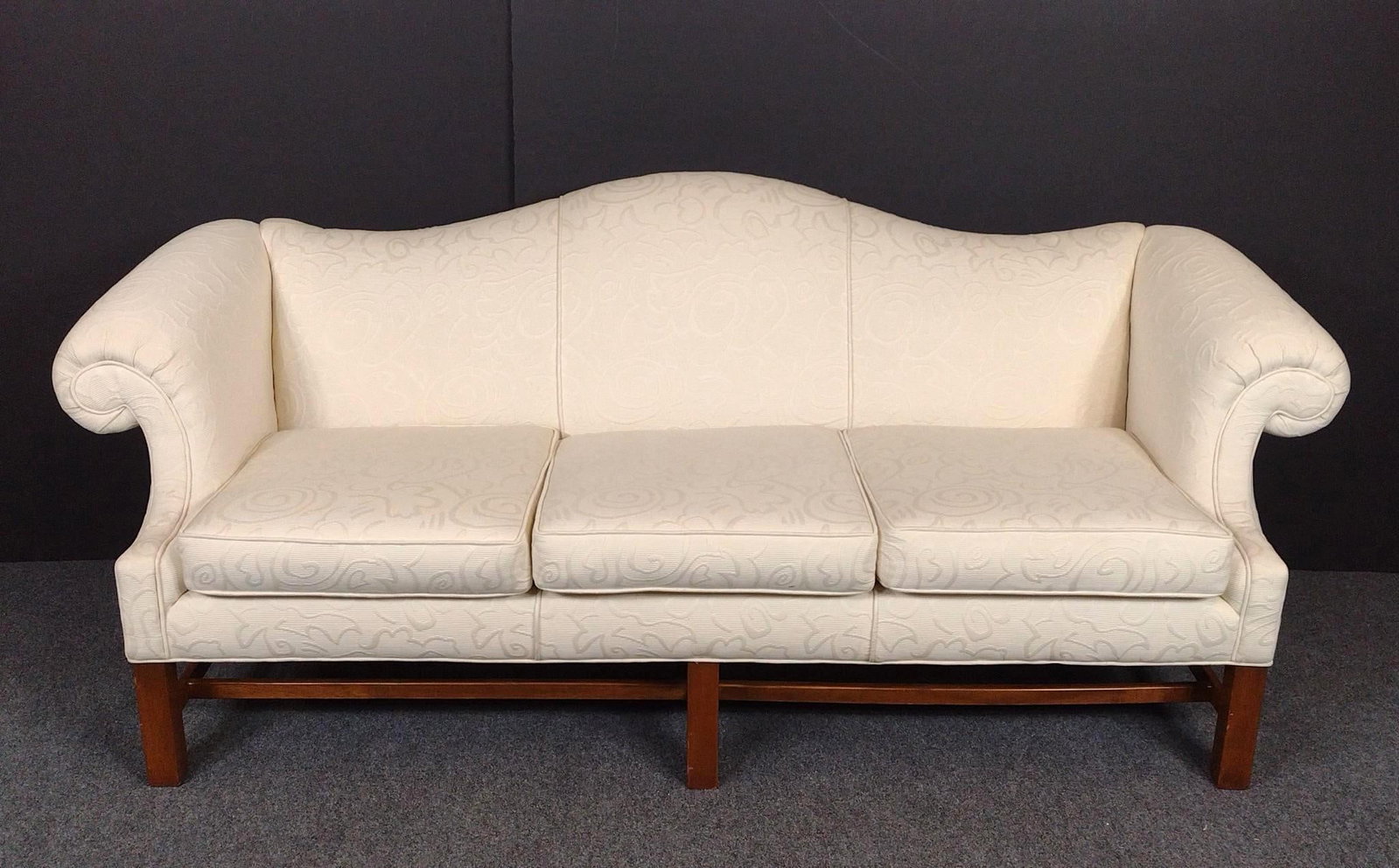 Camelback White Upholstered Sofa: 84" wide X 31" deep X 34" high. No manufactures name found.