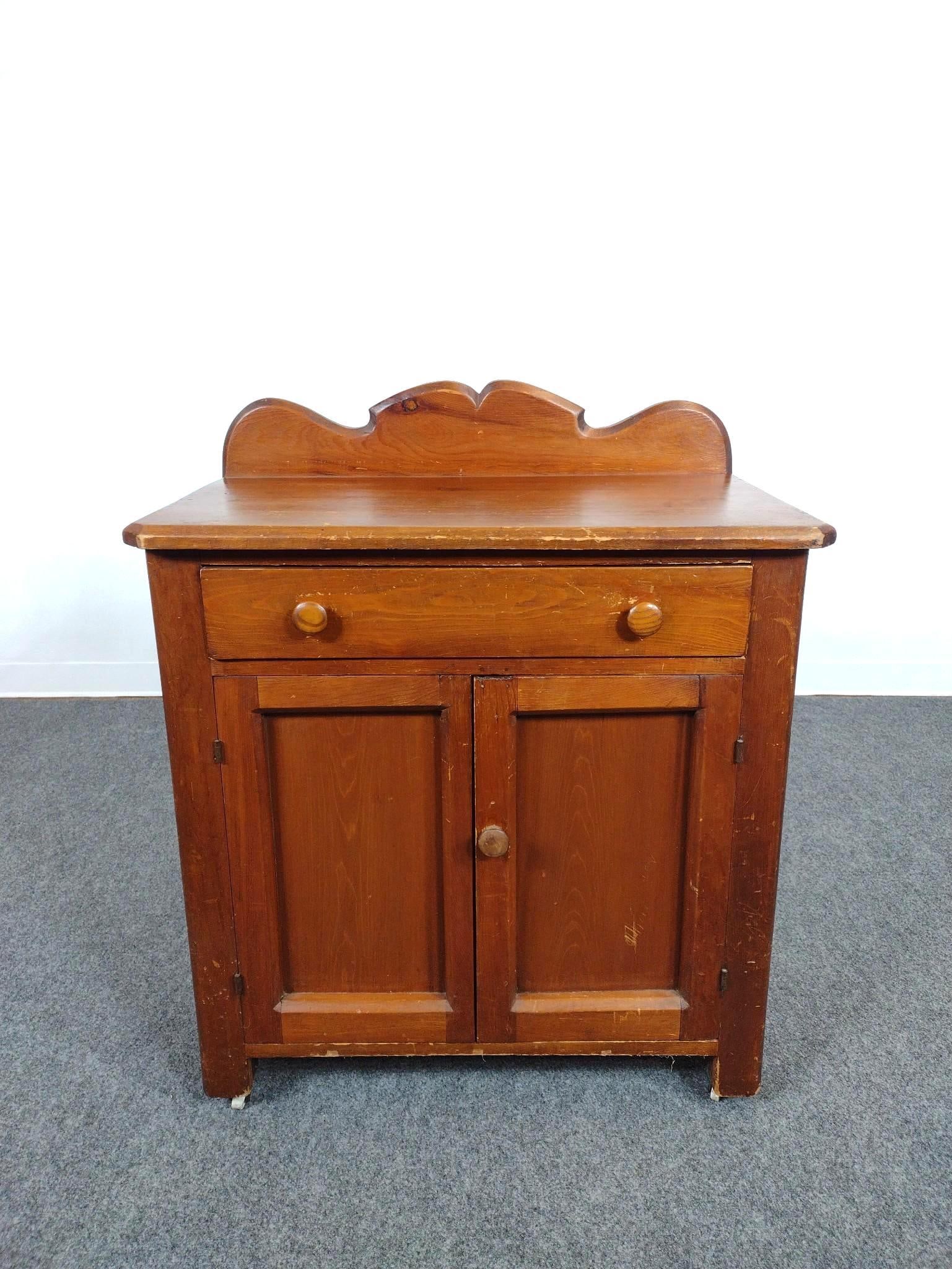 Country Washstand: 29-3/4" wide X 17-1/2" deep X 35-1/2" high. Has scratches. One caster has repair.