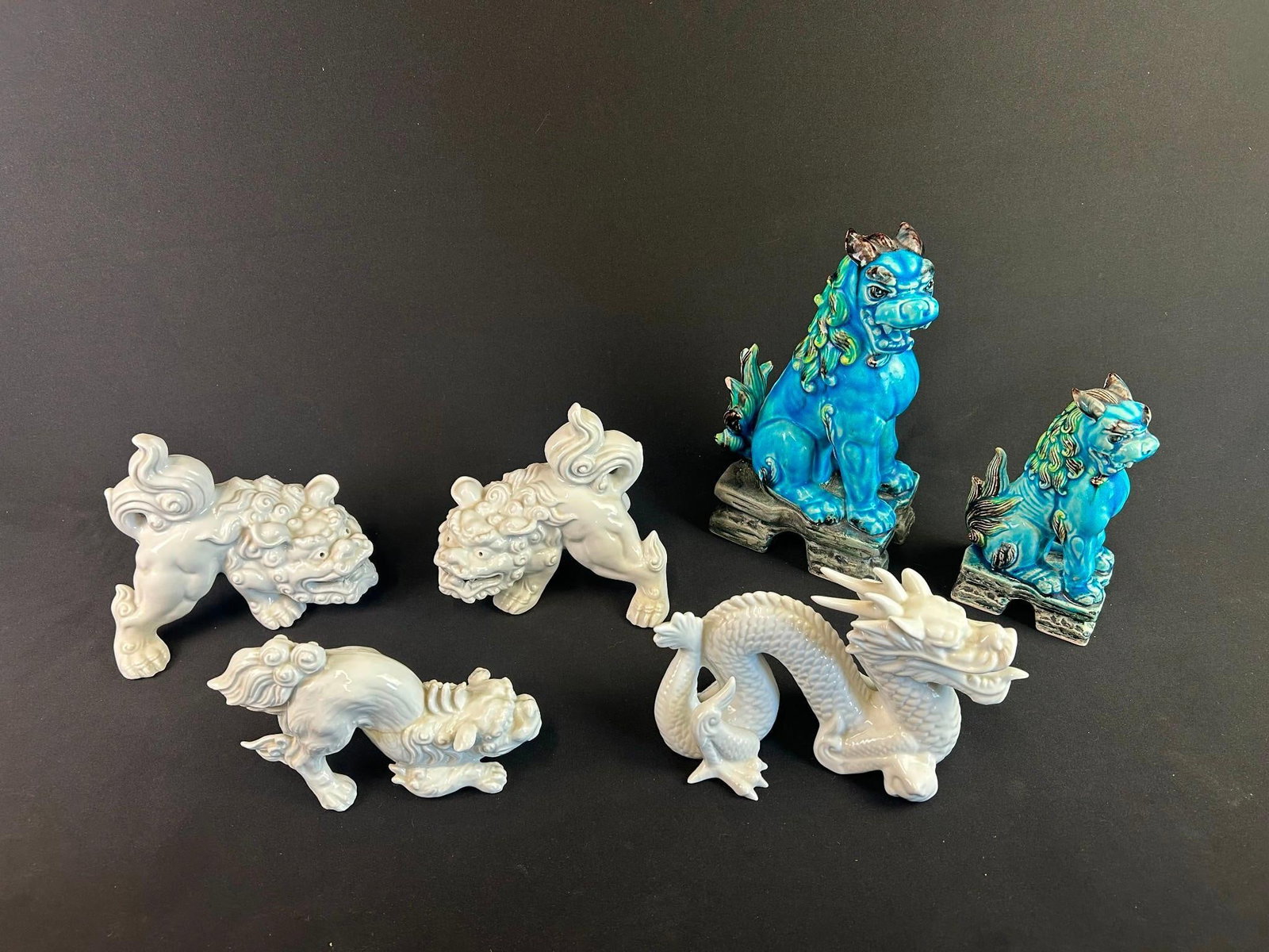 6 Asian Porcelain Figurines Incl. Foo Dogs: Also includes dragon. 3" to 4-1/2" wide x 4-1/2" to 10-1/4" high. 
