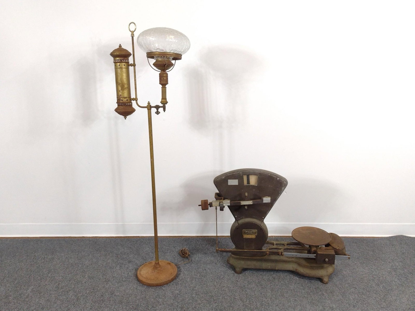 J.J. McIntyre Sons Scale and Metal Floor Lamp: Scale 33" wide X 11" deep X 25-1/4" high. Lamp 16" wide X 10-1/2" deep X 57-1/2" high. Both have rust. 