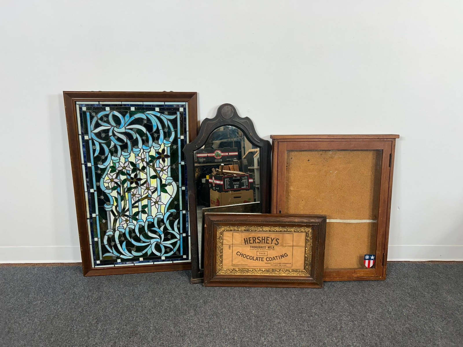 Framed Wall Decorations: One stained glass window piece, one mirror, on wall display box, and one vintage Hershey framed paperwork. The largest is 37 1/2" X 24" and the smallest is 15" X 24"