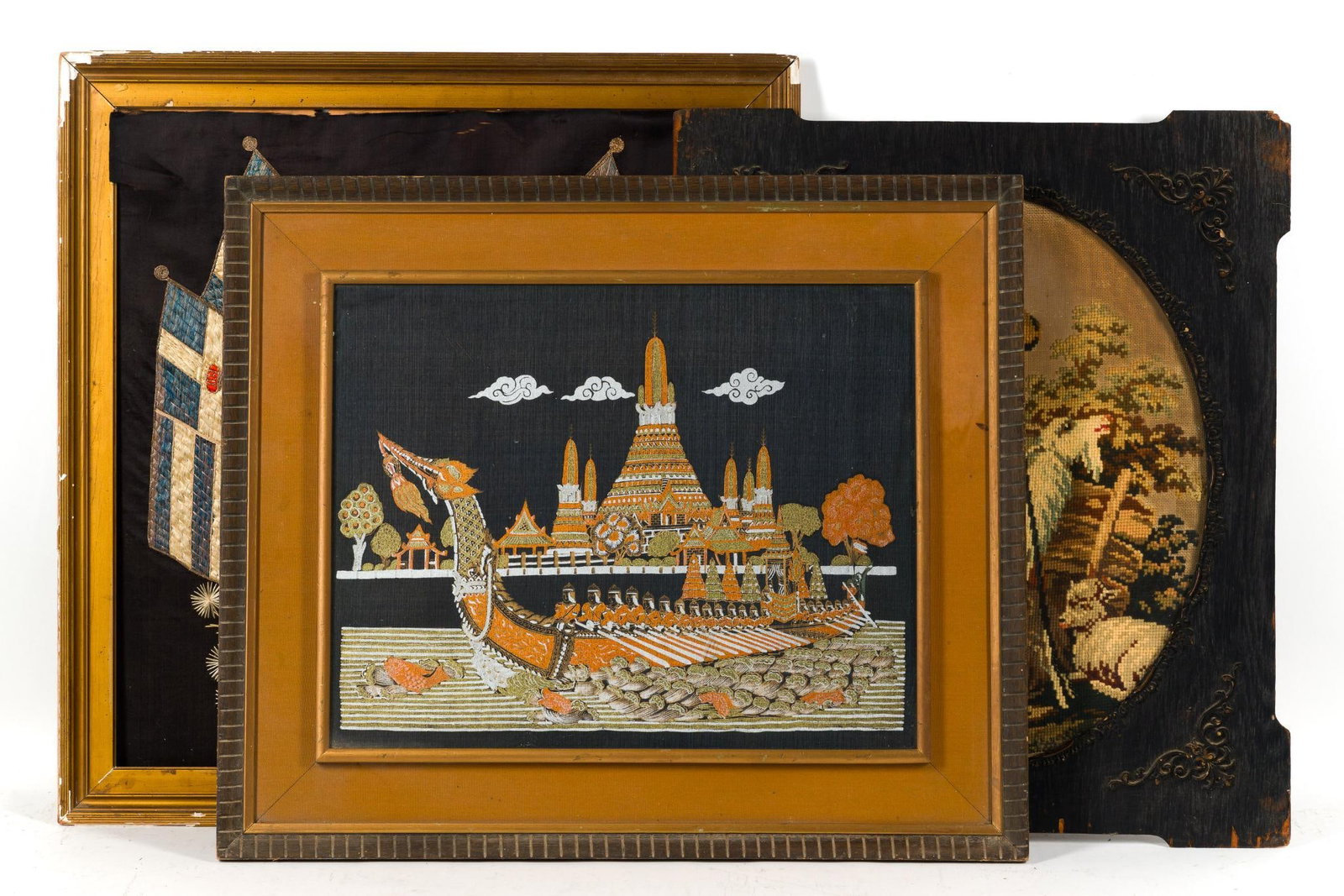 3 Tapestries Incl. Antique Needle Point: 319th Century Greek Royal Coat of Arms embroidery in silk. It has severe decay. Vintage Thai silk painting. Antique needlepoint tapestry. Largest frame is 26 1/2" X 25 1/2".