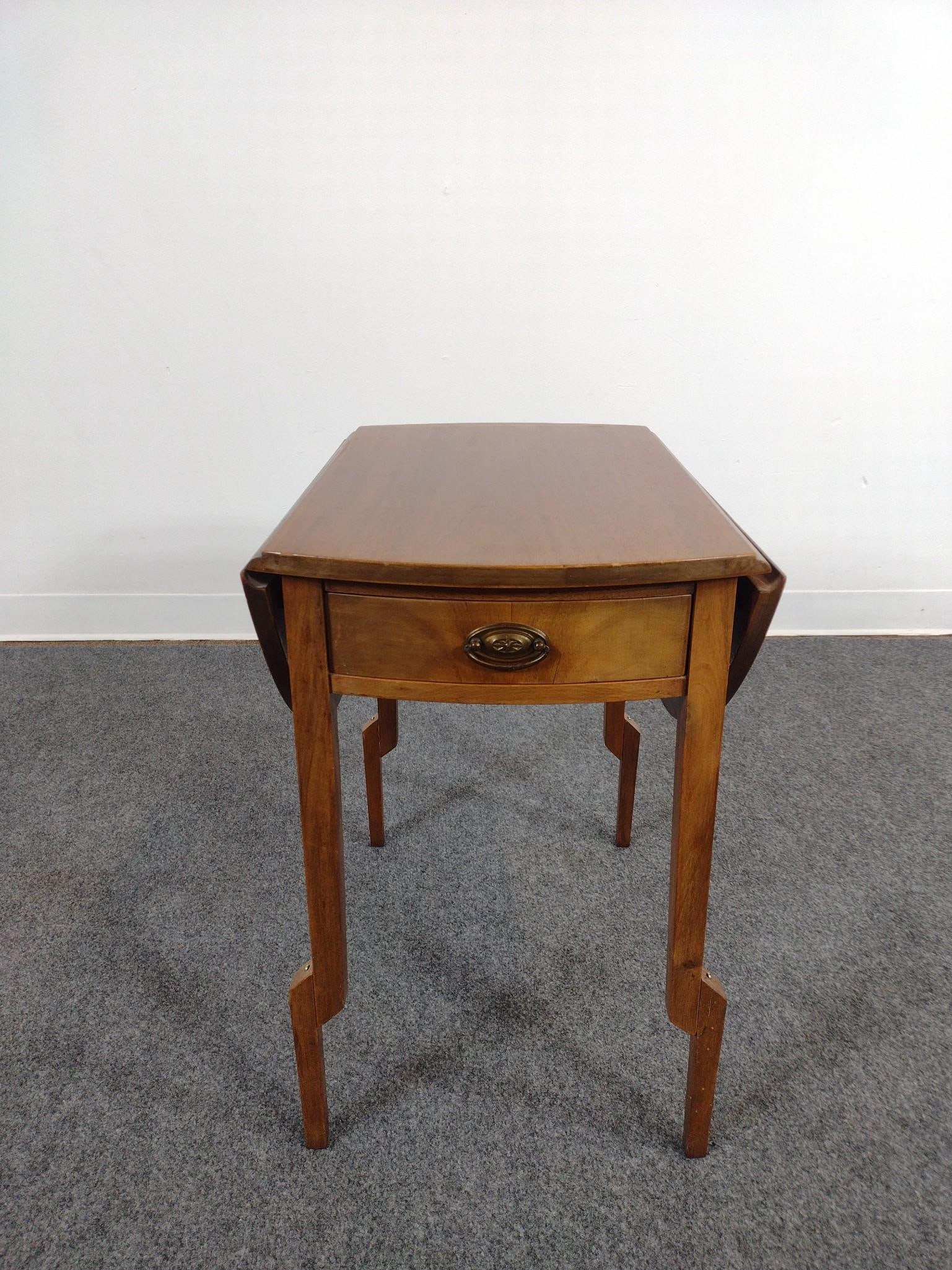 Drop Leaf End Table: Open 30-1/2", closed 15" wide X 22" deep X 22-1/4" high. Top has sun fading. Also has some light scratches. No manufactures name found.