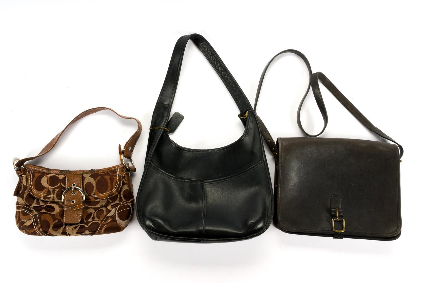 3 Coach Handbags: All marked. Includes satchel and two handbags. Satchel measures 10-1/2" x 3" x 9", the brown bag has some losses on the leather trim and measures 10-1/2" x 3" x 7" and the black purse