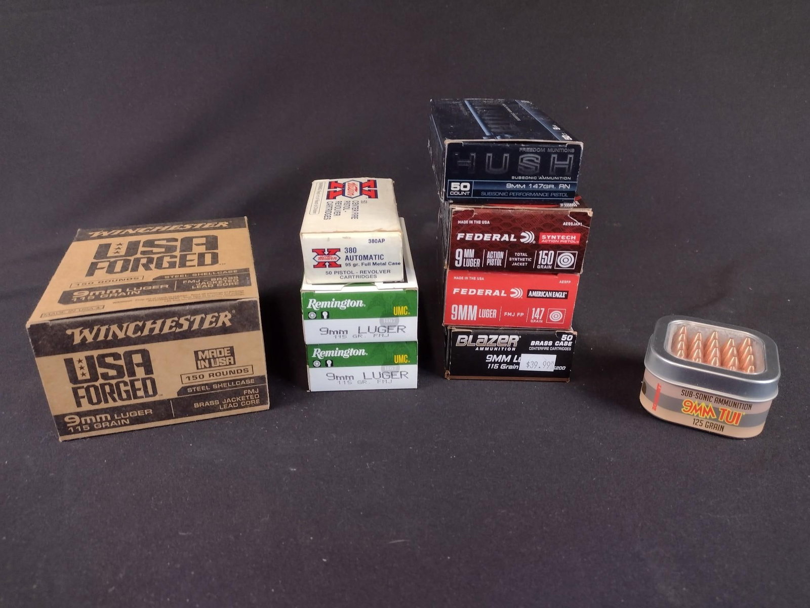 9 Boxes of 9mm Rounds: Includes 2 boxes of Remington 9mm, 1 box of Winchester 9mm, 2 boxes of Federal 9mm, 1 box of Blazer 9mm, 1 box of Federal Hush 9mm, a box of X Western center fire pistol rounds, and a box of Origin