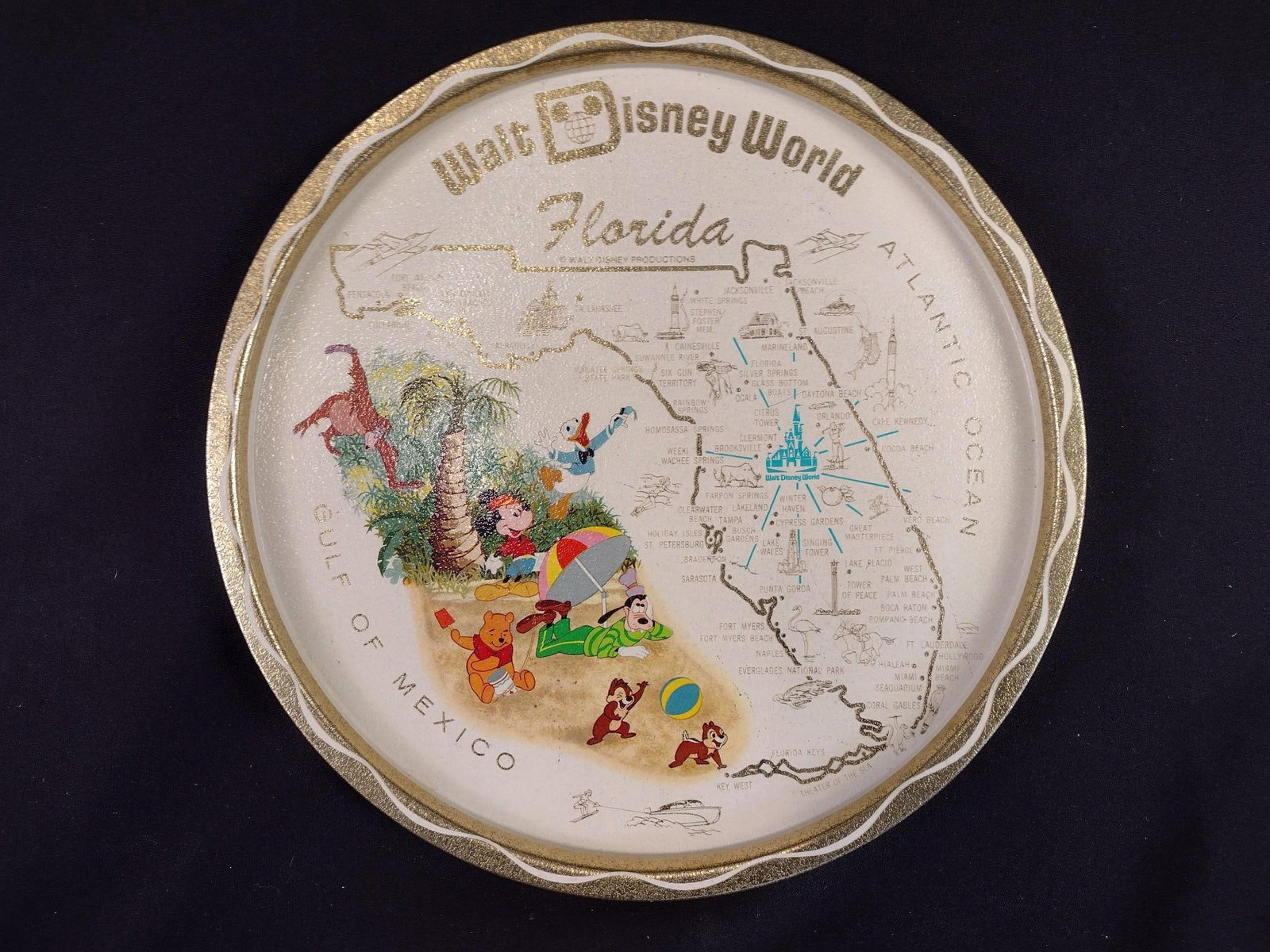 1970's Walt Disney World Metal Drink Tray: Measuring 11" in diameter, the tin tray is in very good condition exhibiting light wear.