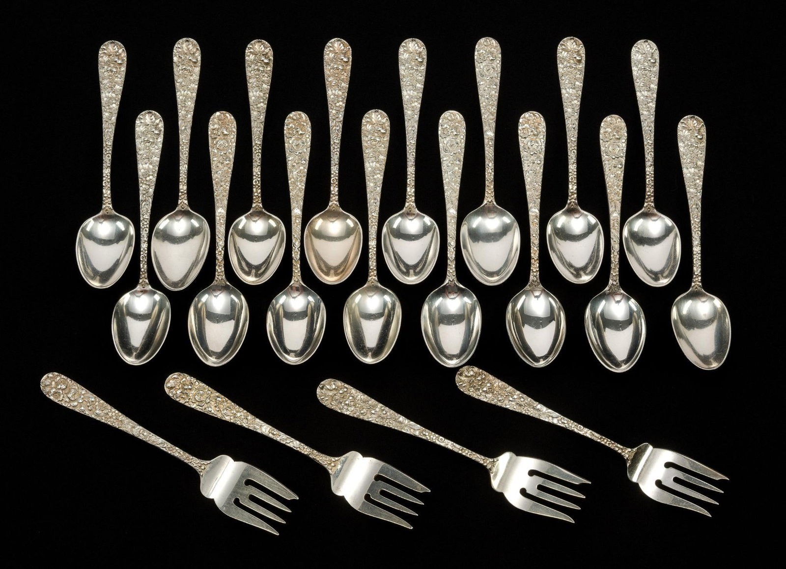 Stieff Repousse Sterling Silver Flatware: Sixteen teaspoons 5 7/8" and four 6" salad forks, all Stieff Rose Repousse. Total weight is 20.5 troy ounces. 