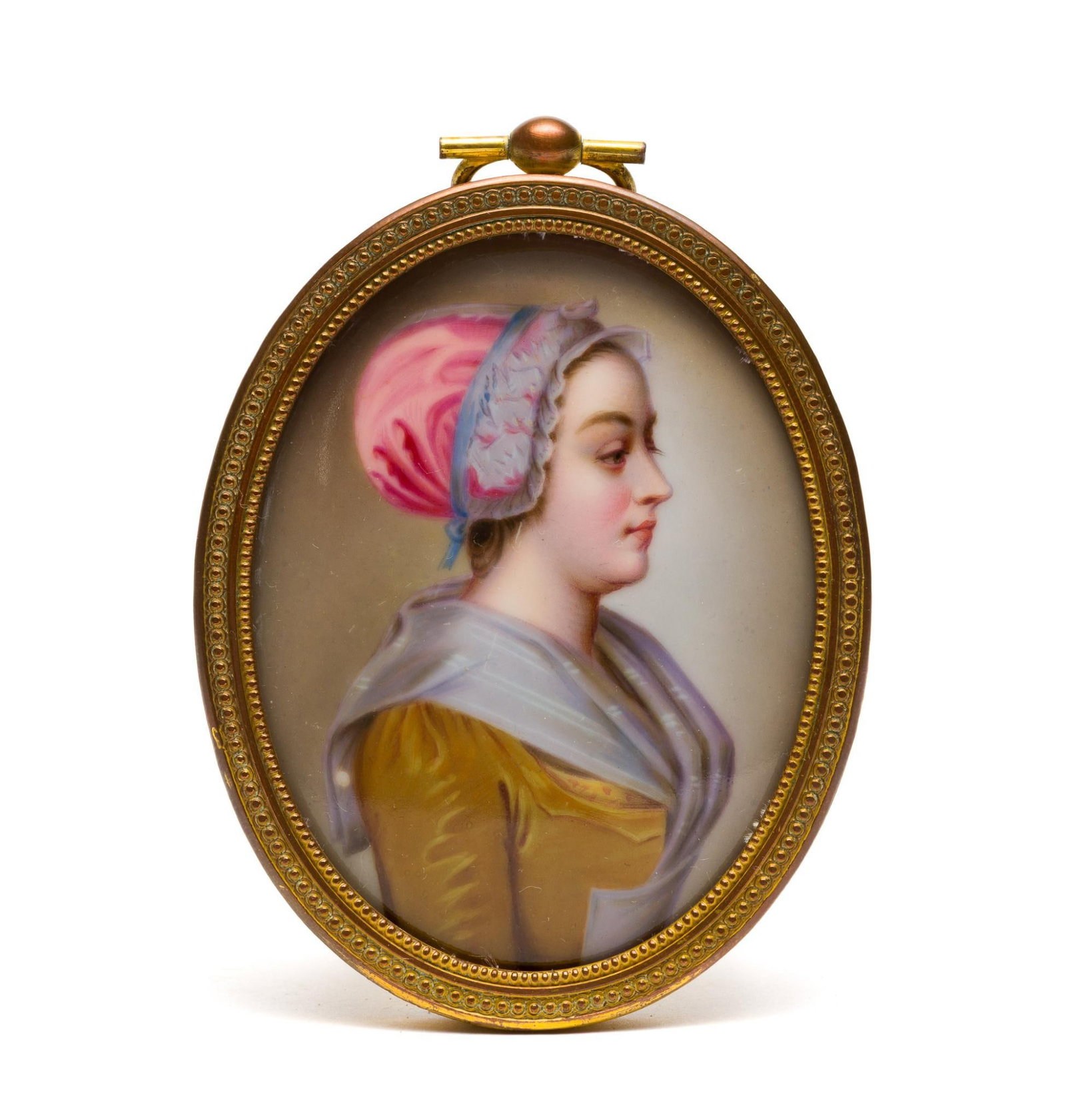 Antique Miniature Porcelain Portrait Painting: A 19th-century well-painted miniature after Jean-Étienne Liotard, "La Belle Chocolatier", 18th Century, 3 1/2" X 2 3/4". It is convex and housed in a copper-and-brass frame. 