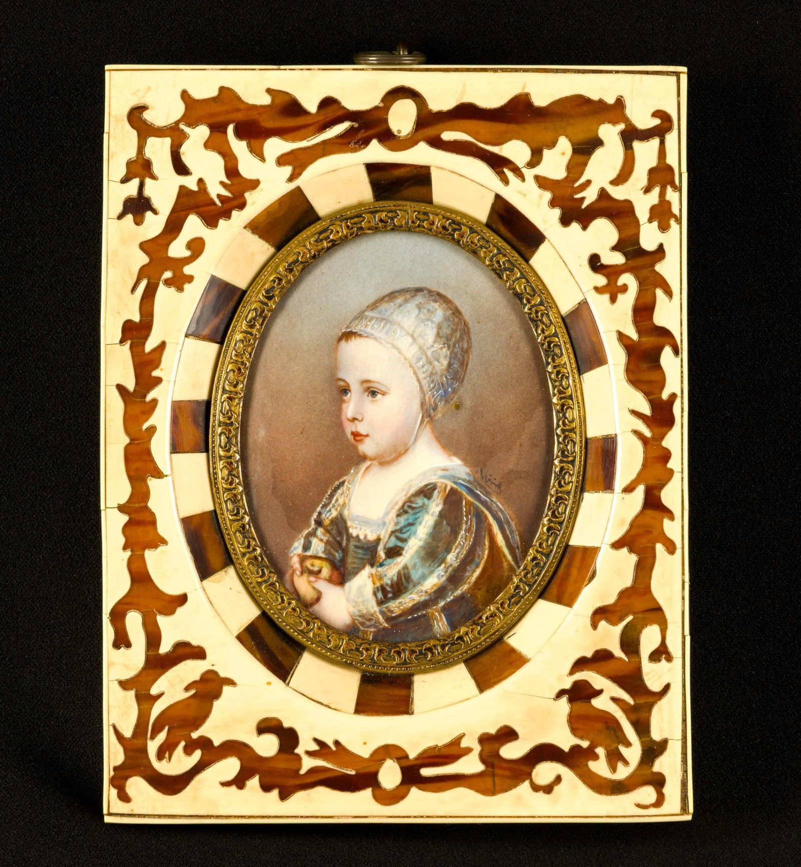 Antique Miniature Portrait Painting: A 19th-century oval convex portrait piece in a bone laminate frame. After Baby Stewart by Anthony Van Dyke, Flemish, 17th Century. Signed over the shoulder. The frame is 6" X 4 1/2".