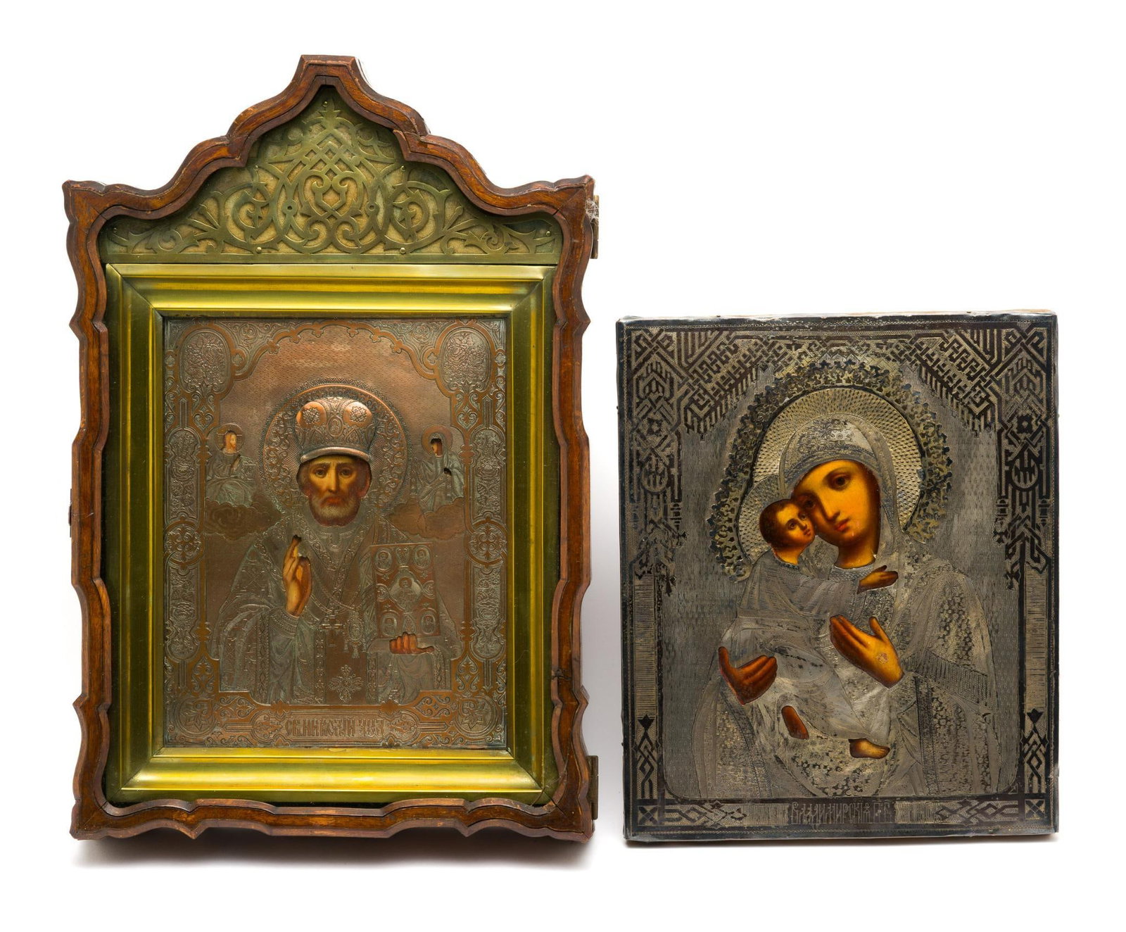 2 Russian Orthodox Religious Icons: Includes an 800 silver Mother Mary & Child (C. 19th Century) and a copper Saint Nicholas. Saint Nicholas icon is in a wood display case. Mother Mary & Child is marked 800 on the bottom. Mother Mary & 