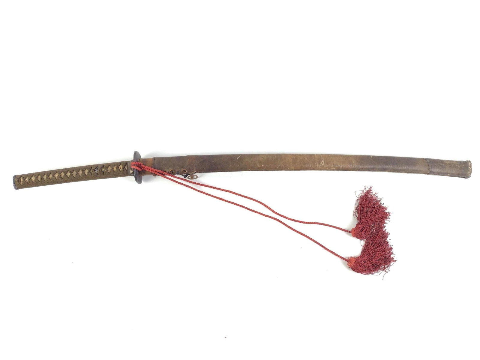 Antique Japanese Katana with Leather Bound Scabbard: No markings on the visible blade; a traditional olive-colored tsuka wrap over an intricate handle with decorative menuki. Intricate metal fuchi made of copper; clear signs of age on the sword