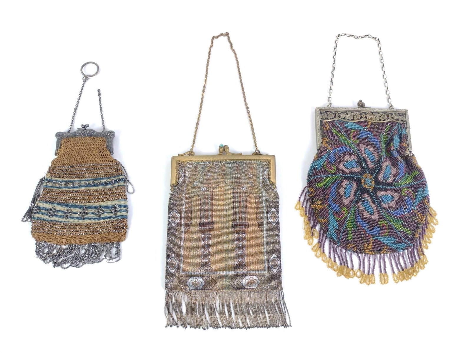3 Mesh Flapper Purses: Includes German Silver (metal alloy) purse, a gold edged metal mesh purse, and an intricately designed beaded flapper bag with metal clasp. Largest measures 5-1/2" x 9" and the smallest measures 4-1/2