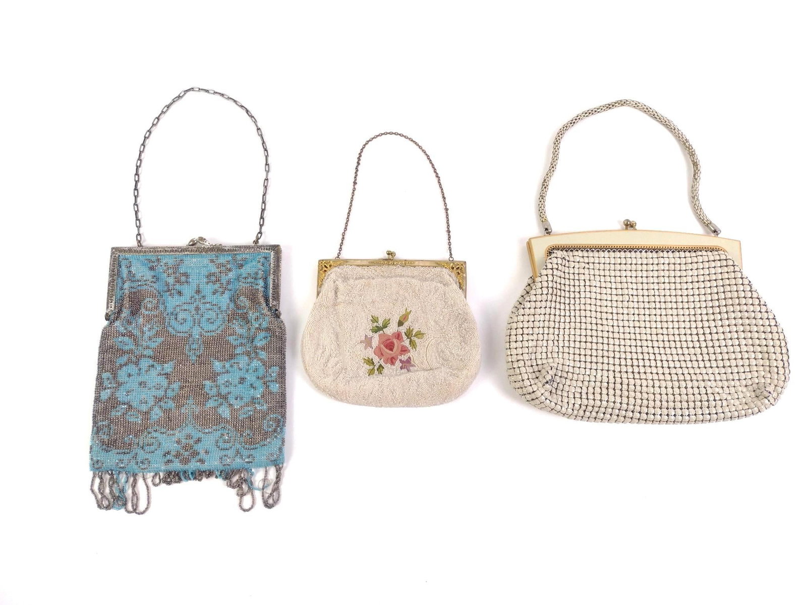 3 Purses Incl. Glomesh: Incudes blue and grey beaded flapper purse made in Germany, a white beaded purse with a flower motif, and a Glomesh white purse. Glomesh purse measures 9-1/2" x 7" and small white purse measures 6-1/2