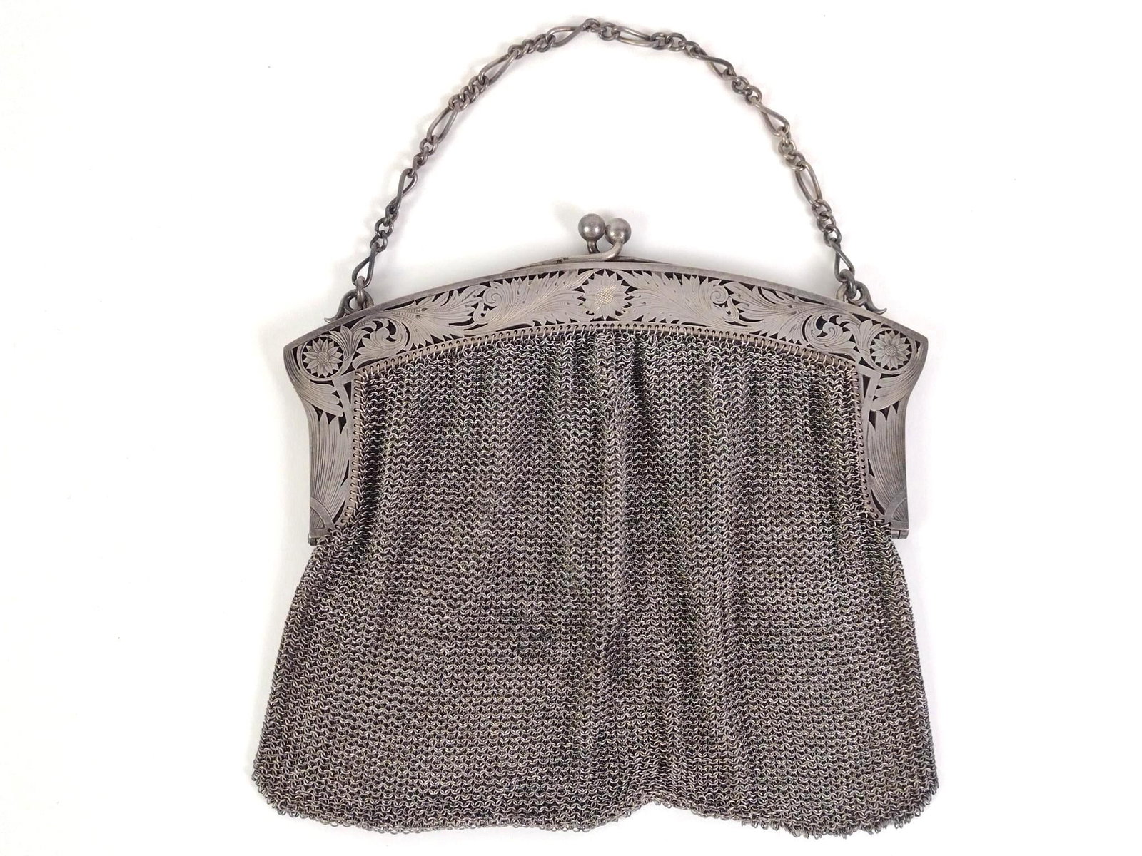 Sterling Silver Mesh Flapper Purse: Stamped "sterling" on the inside edge of the top of the purse. Weighs 7.88 ozt. and measures approximately 6-1/4" x 5-1/2". 