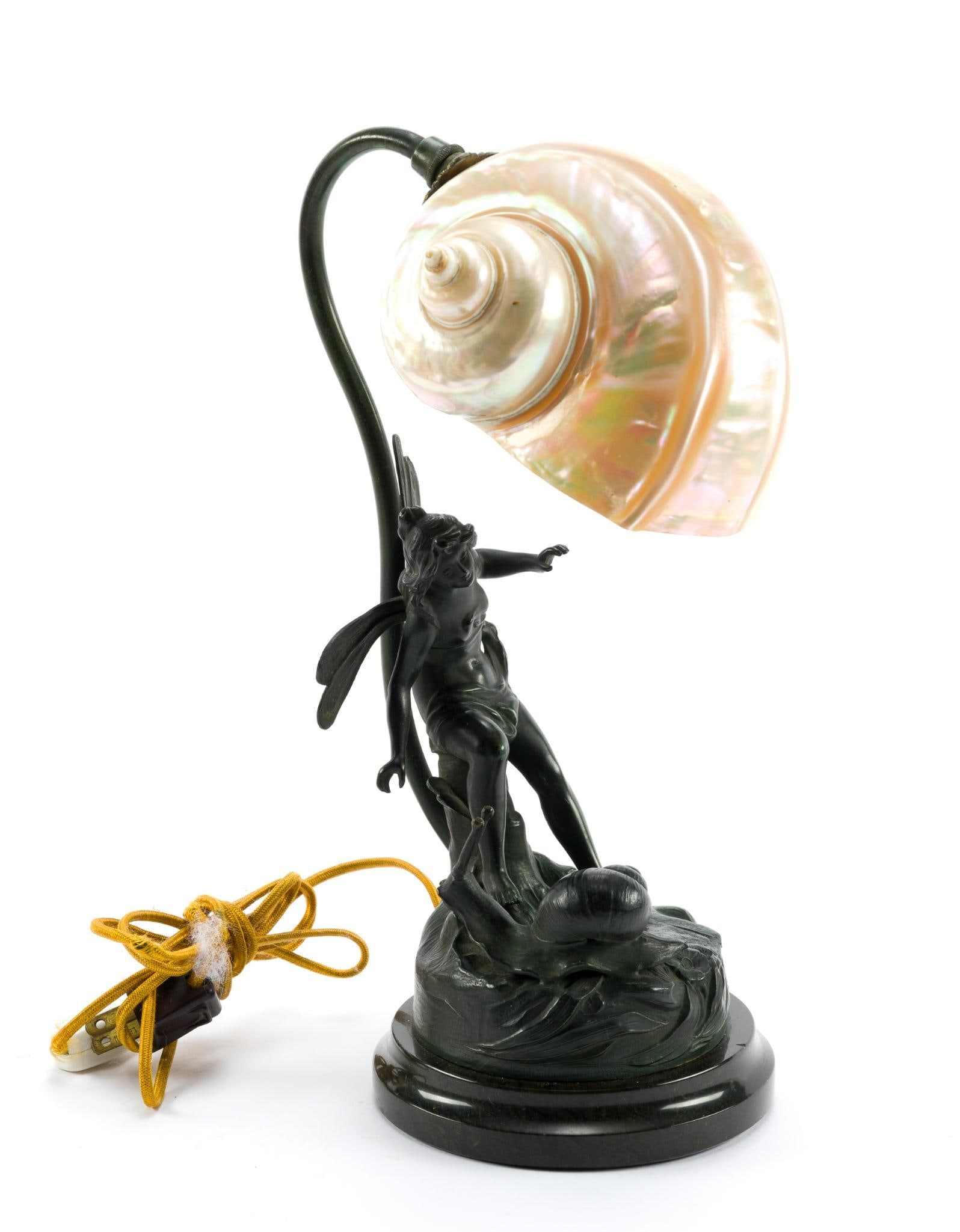 Art Nouveau Style Bronze Fairy Lamp: Fairy lamp with seashell shade. The cord wrapping is frayed. The lamp is in good condition. MEASURES ~12-1/2" from top to bottom.