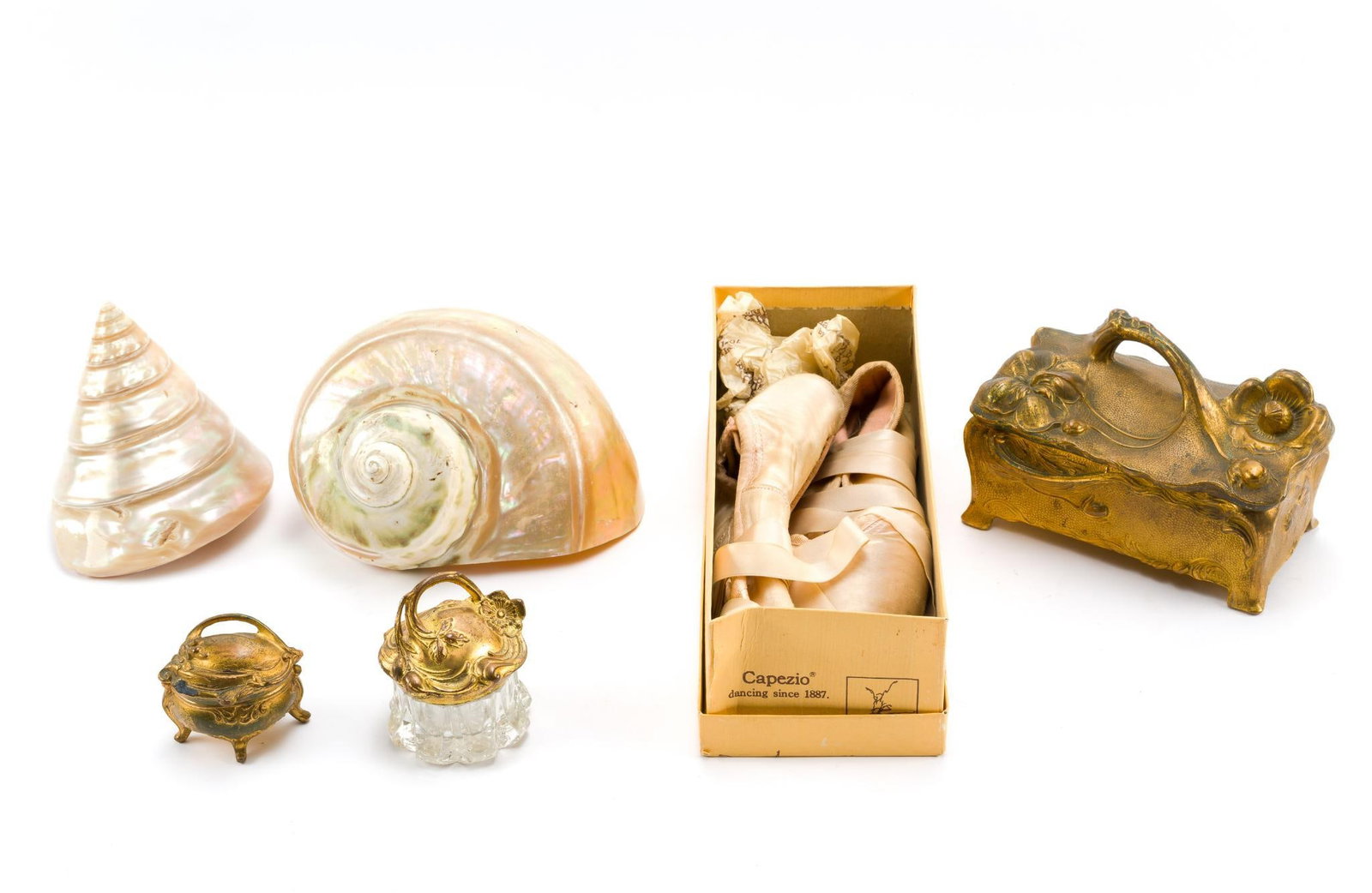 3 Art Nouveau Brass Jewelry Caskets with Decorative Accessories: 1.) Pair of Capezio ballerina pointe shoes, worn and in used condition, in original box. Box measures 4" x 10-1/2". 2.) (2) Pearl white seashells. 4-1/2 to ~ 6-1/2". 3.) (3) Brass Art Nouveau