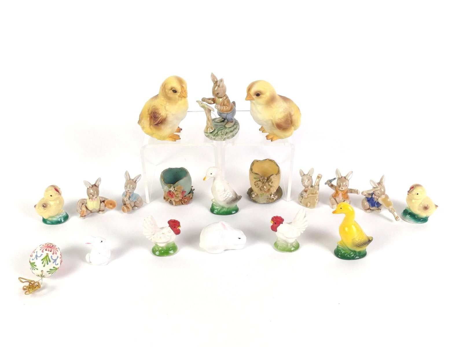 17 Vintage Porcelain Easter Statuettes: Includes 2 resin half eggs. Largest piece measures 3" x 2-1/2" x 3-1/2" and the smallest measures 1" x 1-1/4" x 1-1/2". 