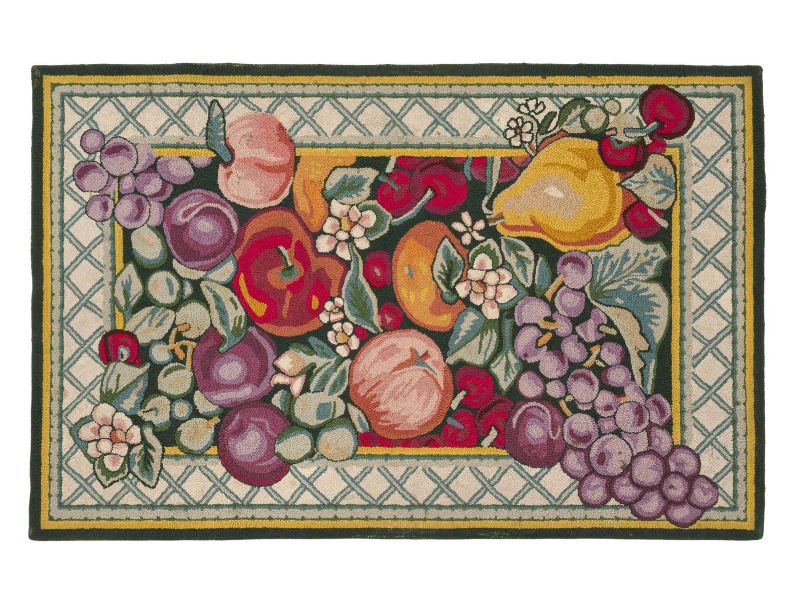 20th Century Fruit Decorated Hooked Rug: Hooked rug depicting an arrangement of fruit and blossoms, including grapes, pears, peaches, and apples, within a latticework border. Hooked rugs are a textile form created by pulling loops of wool fa