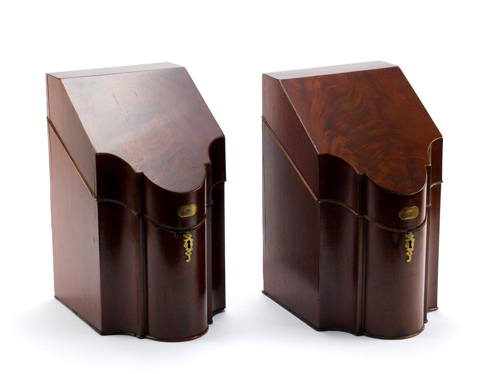 Pair of Georgian Mahogany Knife Boxes: C. 1790-1820. Pair of Georgian-style mahogany knife boxes, each with a sloping hinged lid, shaped serpentine front, brass escutcheon, and fitted removable interior insert with pierced compartments for