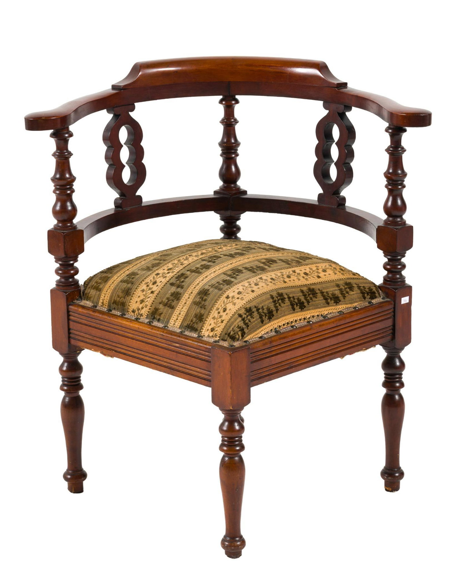 Victorian Corner Chair: A Victorian corner chair, probably from the eastern United States, circa 1870-1880, in the Colonial Revival taste. The form consists of four legs supporting an overstuffed upholstered frame. Each leg