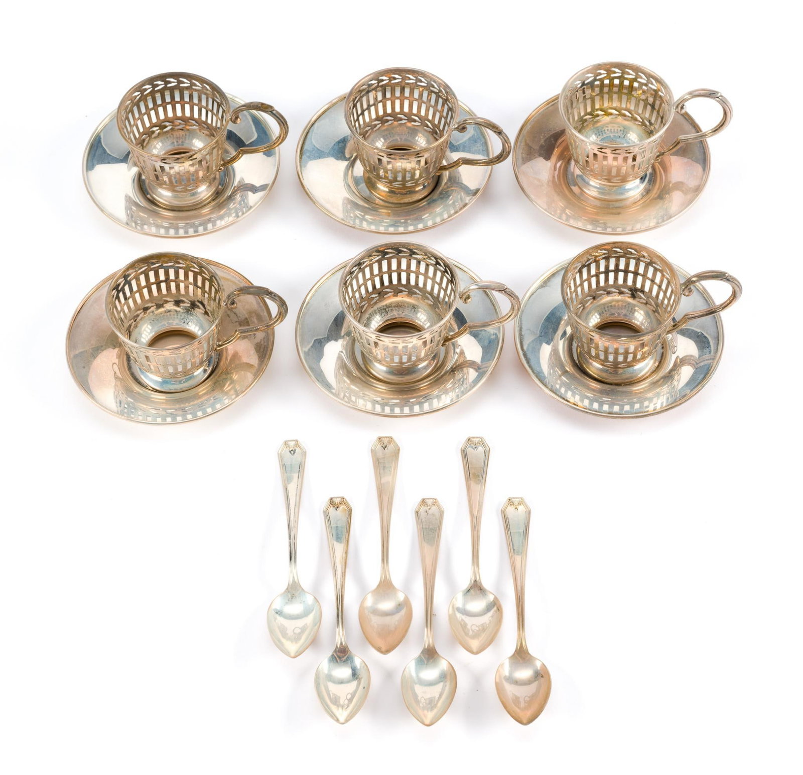 Sterling Silver Demitasse Set: Includes saucers, cups, and spoons. All marked. No glass inserts for cups. 1-3/4" wide x 1-5/8" high. 5.74 ozt total. 